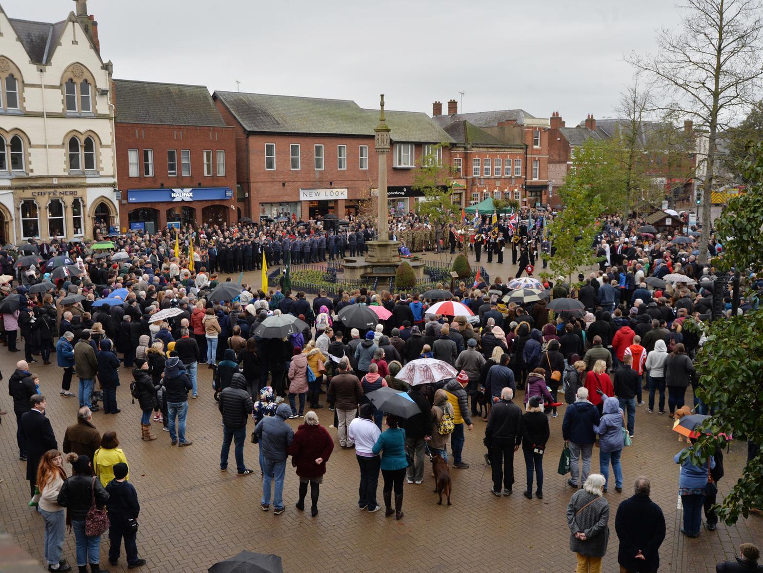 Crowds gather to watch the remembrance wreath laying on the Square.