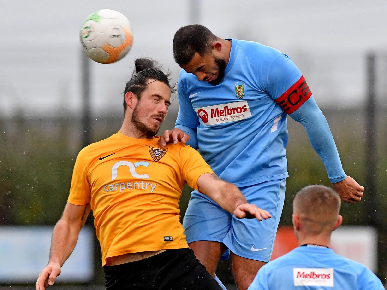 Rugby Town Captain Loyiso Recci wins header in Saturday's game with Harborough