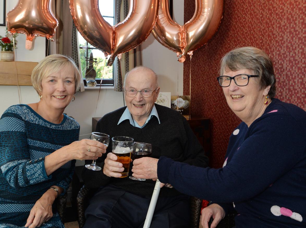 Nick Nicholls celebrates his 100th birthday with daughters Sadie Crowe and Janet Nicholls.