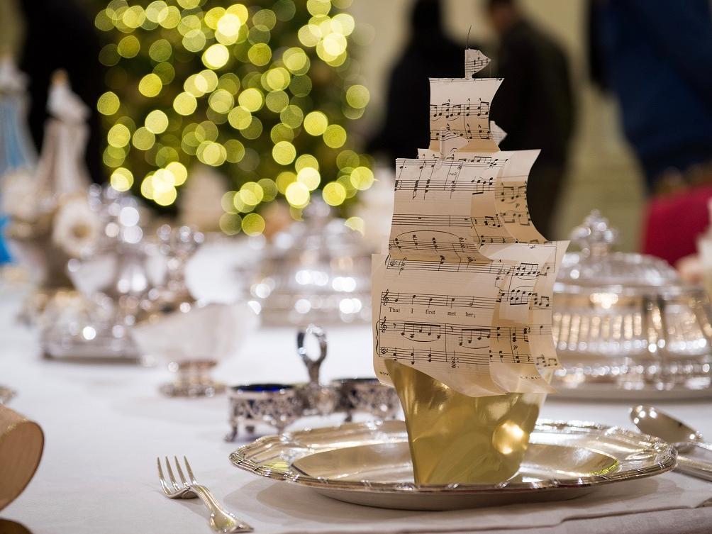 A decorative boat party favour on this table