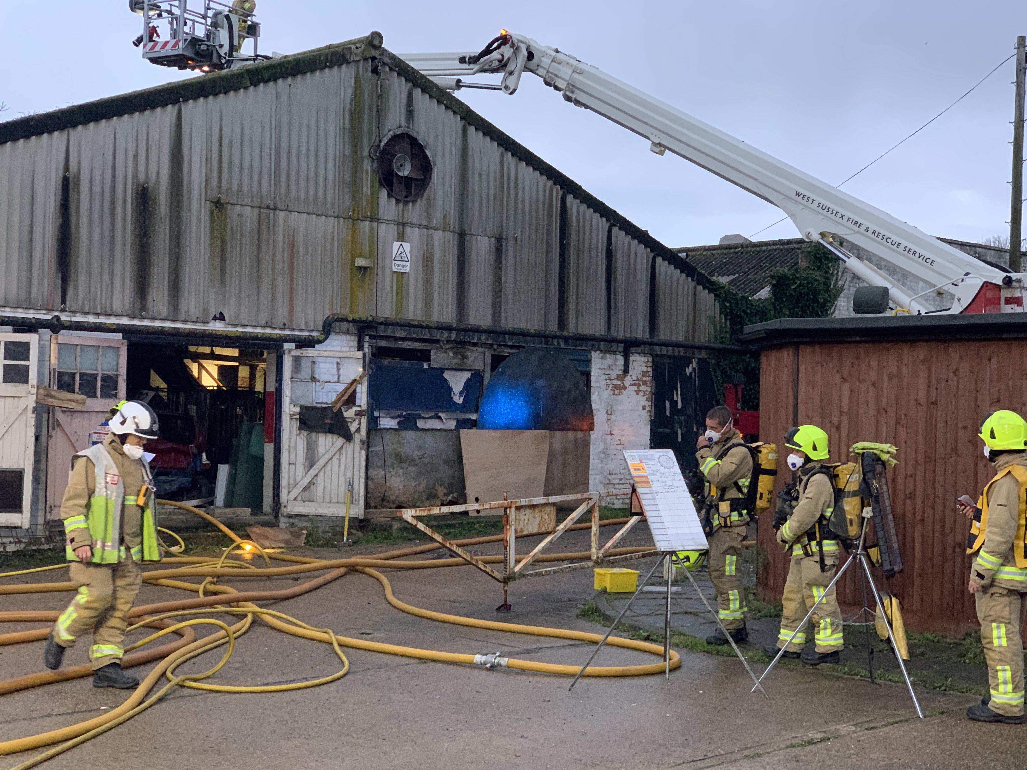 Firefighters at a building fire in Lancing SUS-191124-164927001