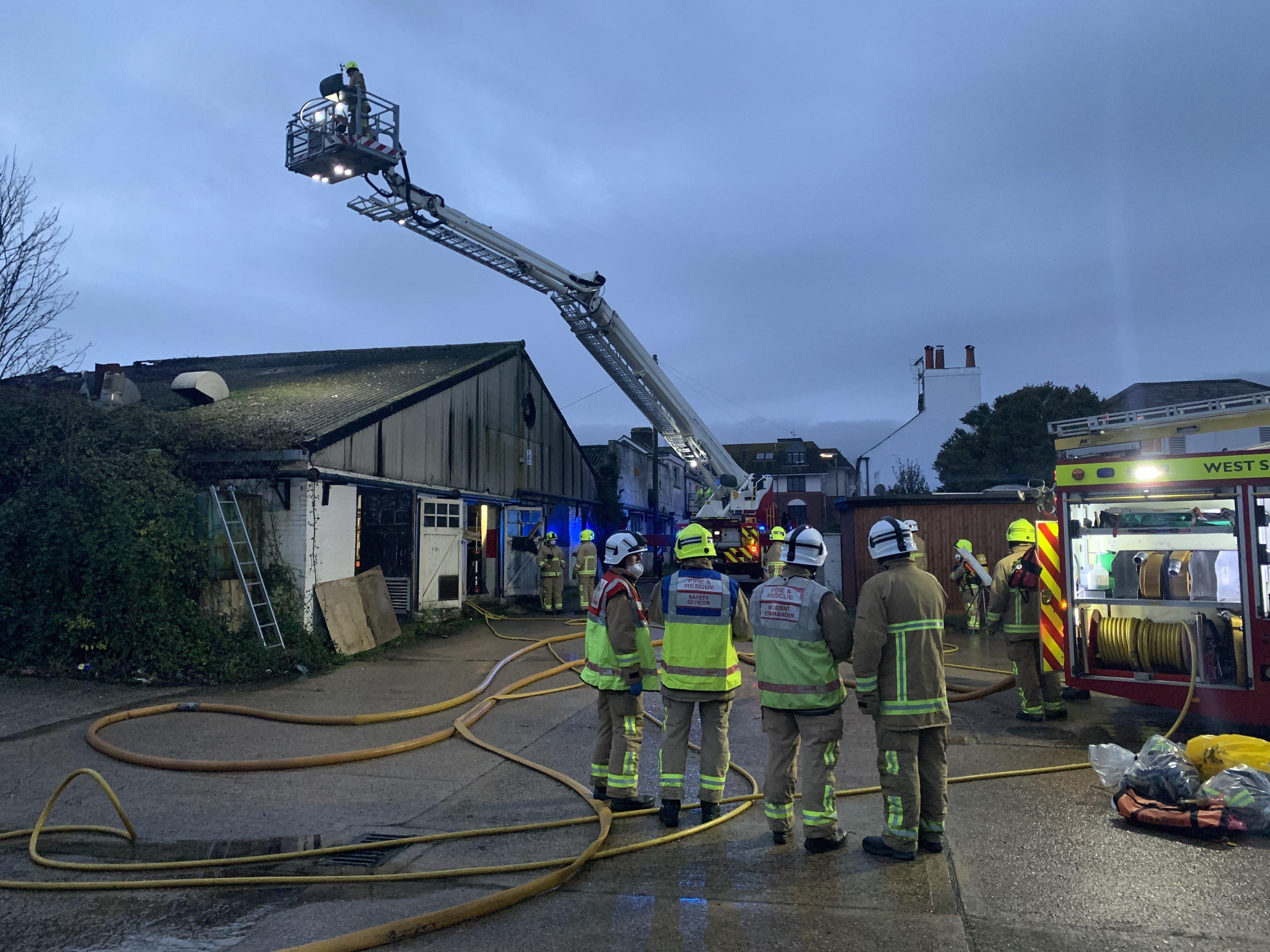 Firefighters at a building fire in Lancing SUS-191124-164842001