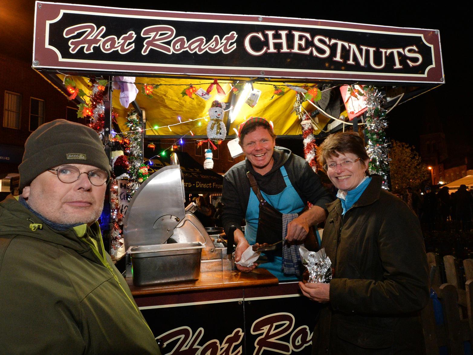 Roasted chestnuts...centre, Eliot Gray of Skegness with Keith and Hazel Francis.