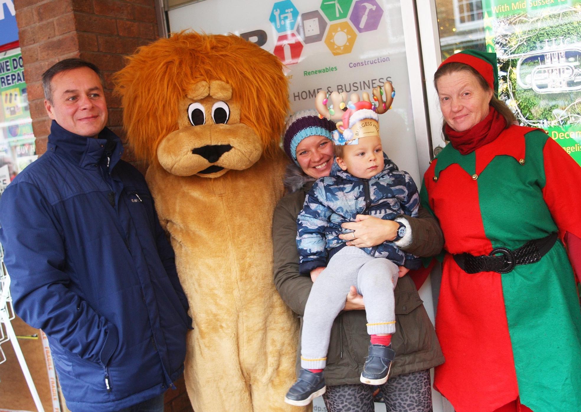 Burgess Hill Christmas activities. Maxim and Olga Nekl and son Michael 2 with Rosemarie Greenwood and Allen Greenwood (the lion). Photo by Derek Martin Photography.