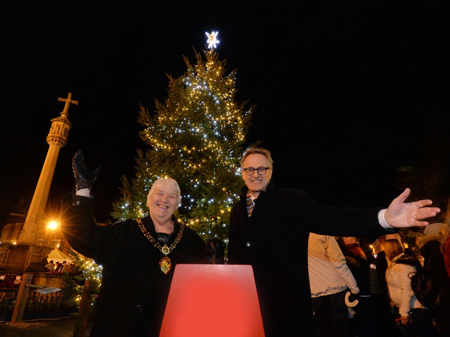 Chairman of Harborough District Council Barbara Johnson and Mark Robinson chief executive of Market Harborough Building Society switch on the Christmas Tree lights on the Square.