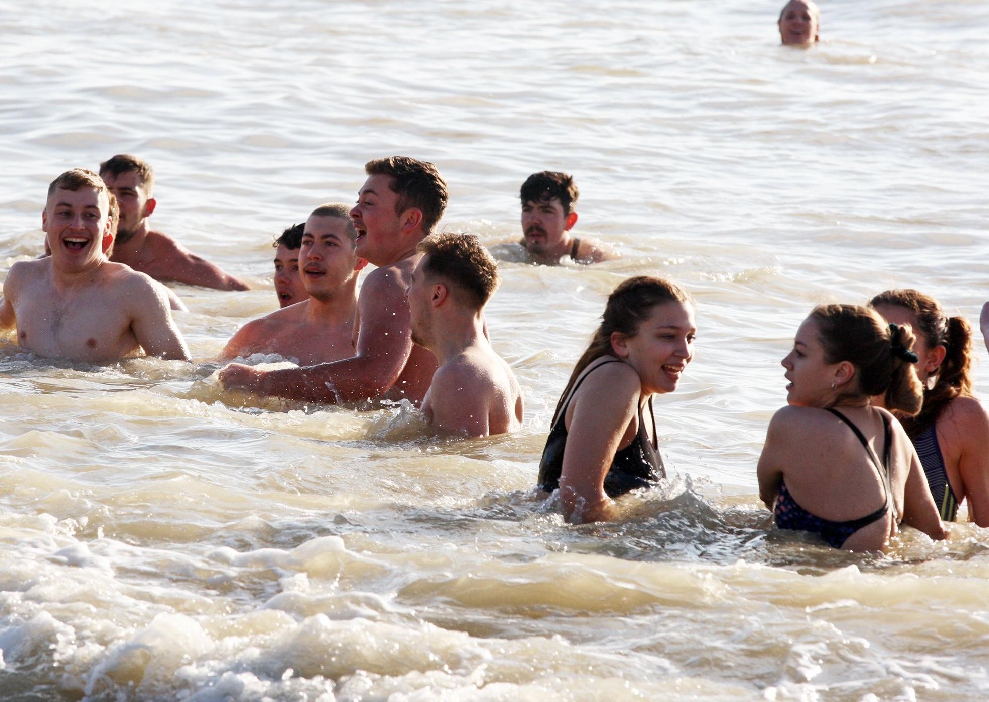 DM19112475a.jpg. Chichester University students take a dip in the sea for Movember. Photo by Derek Martin Photography. SUS-191124-162435008