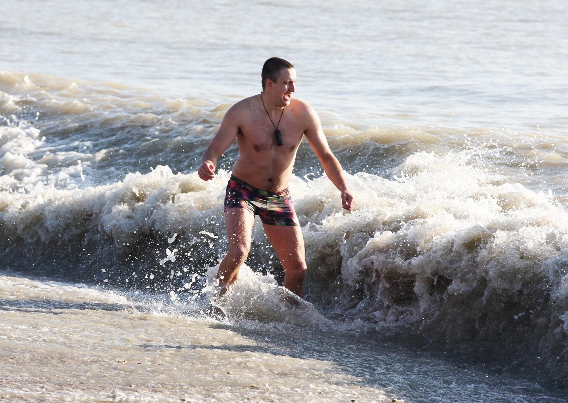 DM19112534a.jpg. Chichester University students take a dip in the sea for Movember. Photo by Derek Martin Photography. SUS-191124-162526008