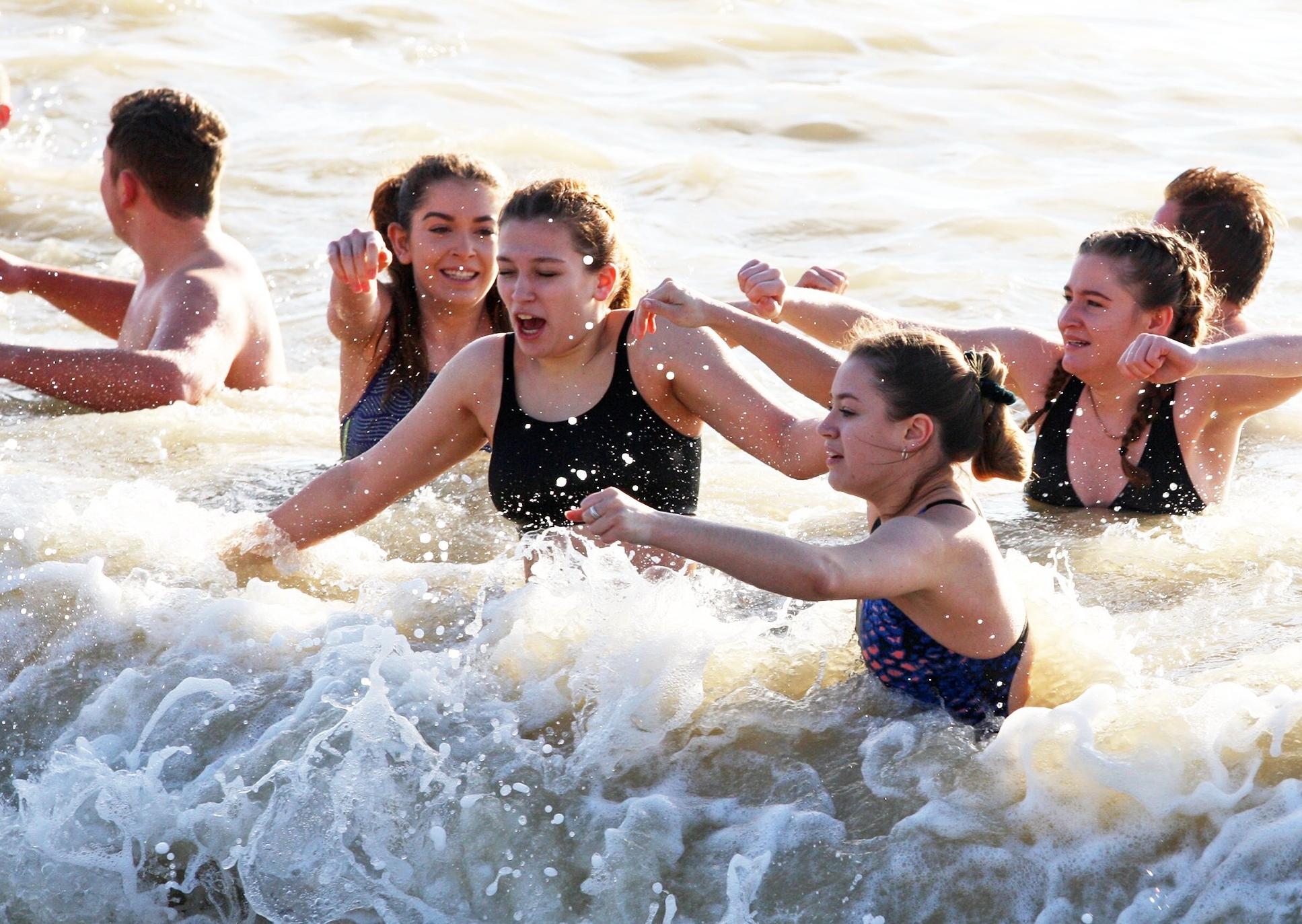 DM19112493a.jpg. Chichester University students take a dip in the sea for Movember. Photo by Derek Martin Photography. SUS-191124-162445008