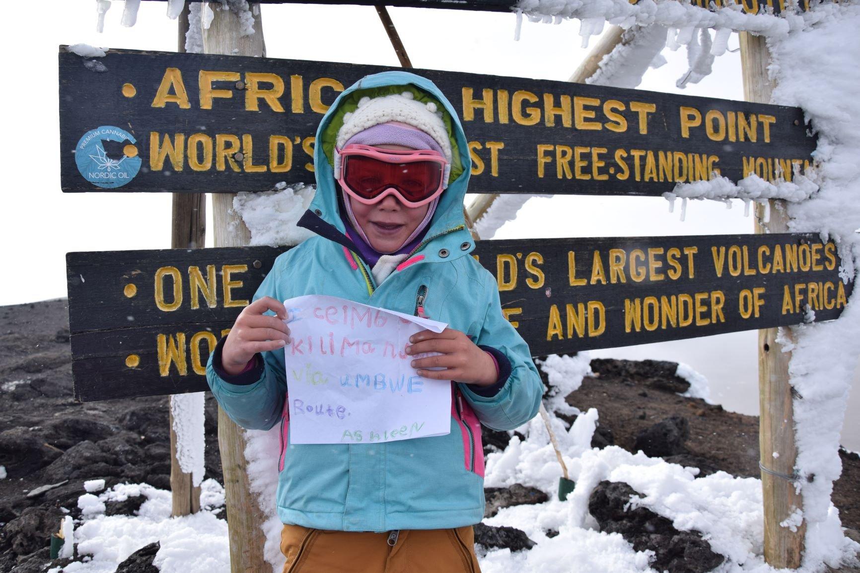 Ashleen Mandrick at the top of Mount Kilimanjaro