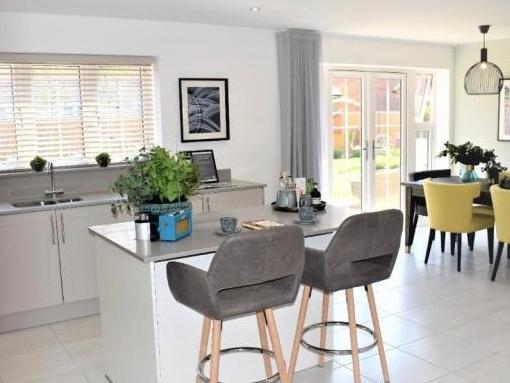 The family home has an open plan kitchen with an island unit