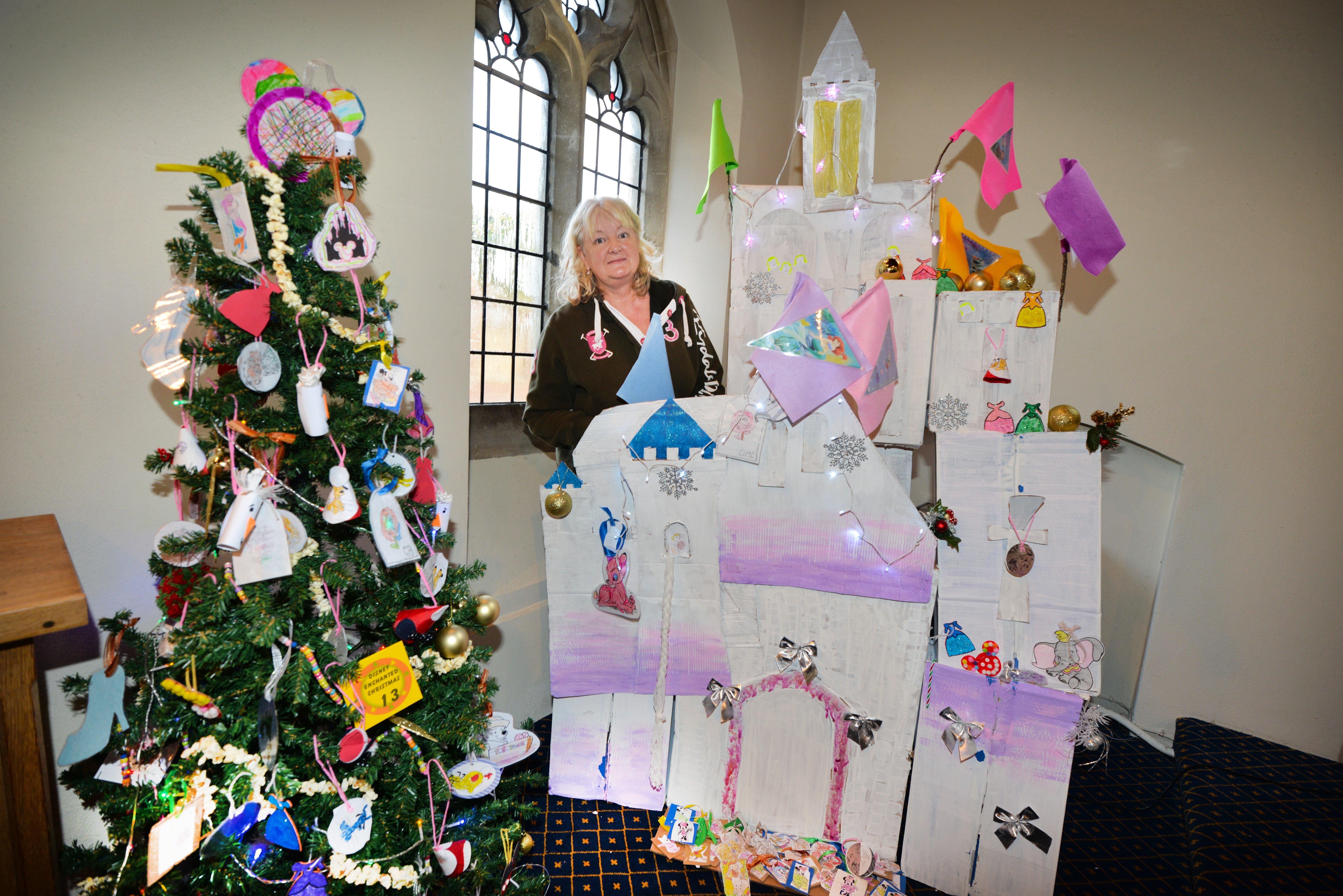 Christmas Tree Festival at St Michael & All Angels, Bexhill.

Angela Lawrence (deputy manager East View Housing) with East View Housing's display, to the right of the photo. SUS-190112-114043001