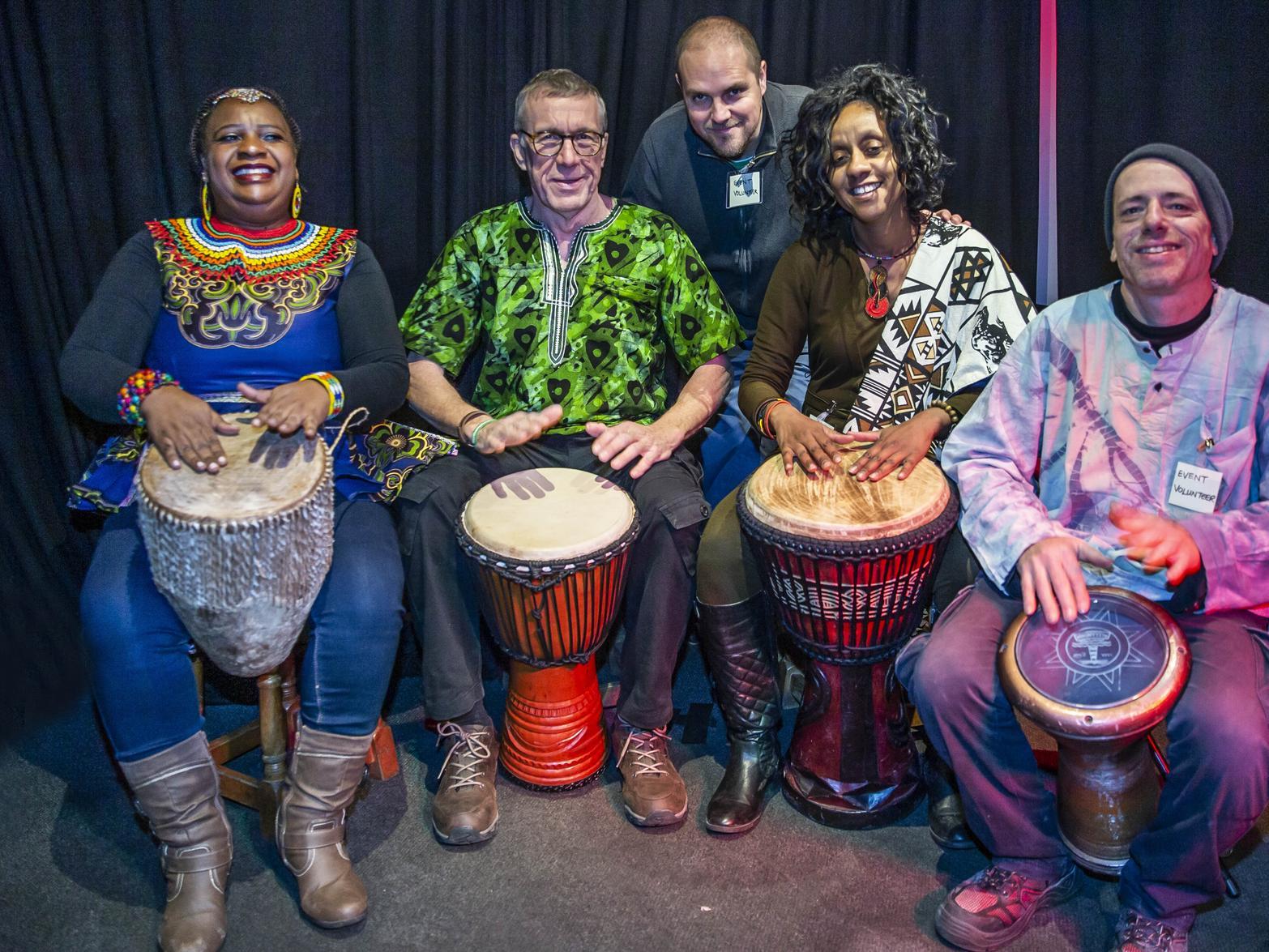 (L-R) Mavis Mundirwa, Richard Dobson, Pedro Duarte, Anne Wankiiri and Mike McArthur have a go at African drumming at the African and Caribbean Festival