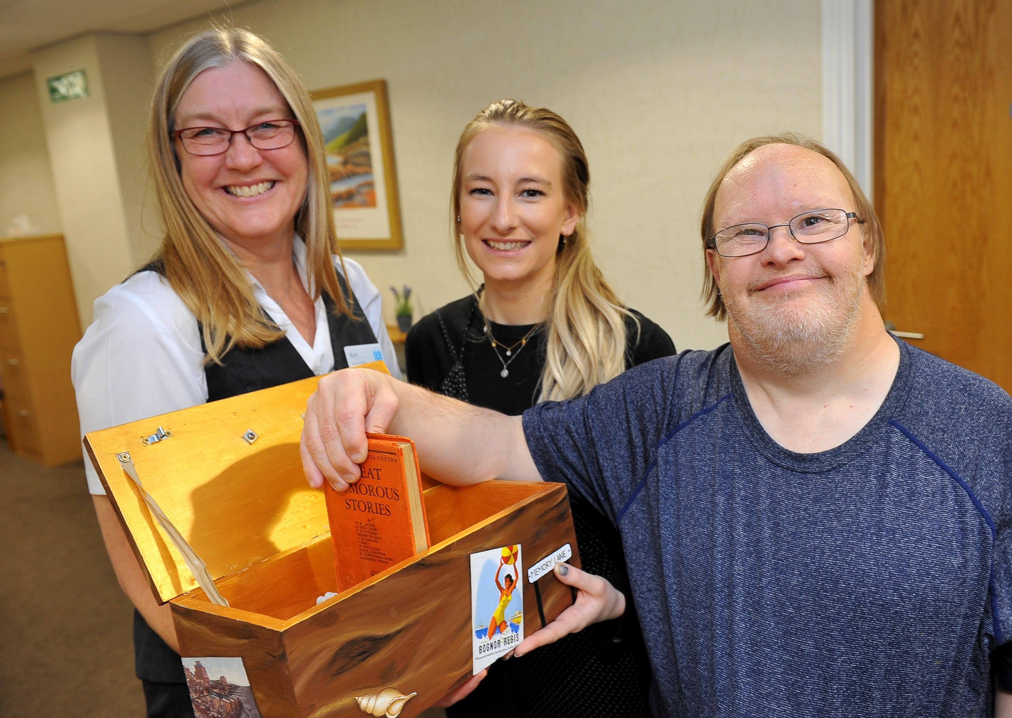 Ruth Frampton (Co-op funeral arranger for pagham), Chloe Belton (art instructor Aldingbourne creative arts studio) and Richard BestCommunity project with Pagham Co-op funeralcare to bring together special Memory Boxes for local residents containing fun vintage everyday items and memorabilia from Bognor Regis. Pic Steve Robards SR27111901 PNL-191127-202950001