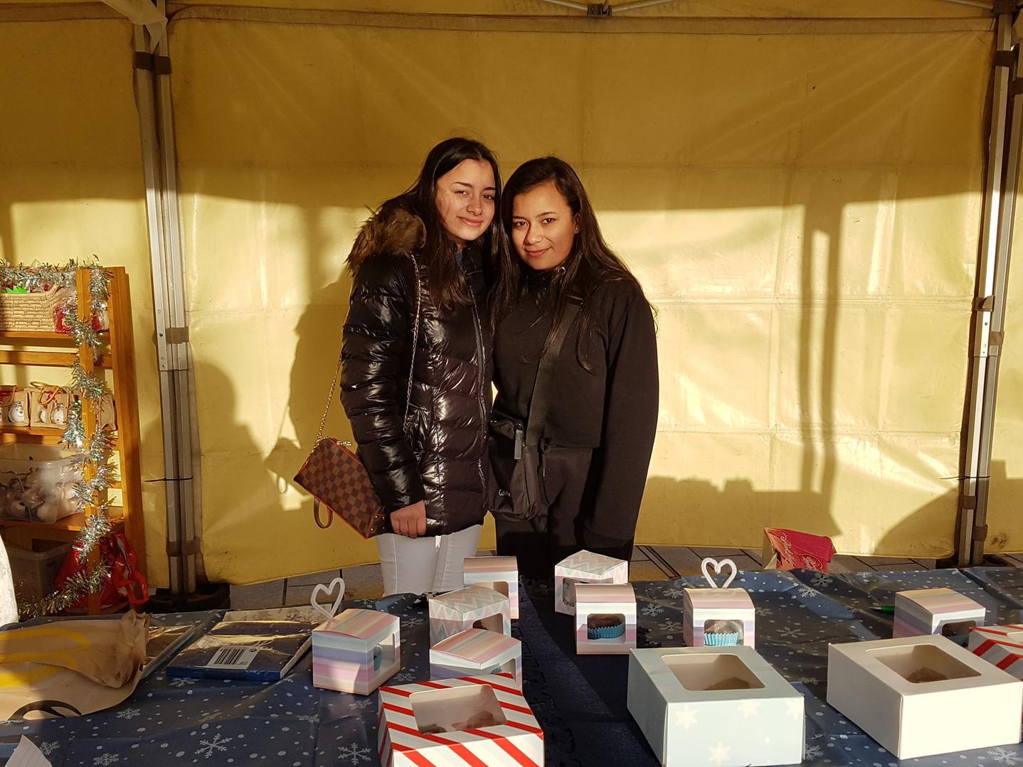 Zahra Haque, 15, (left) was running a bakery stall with the help of her younger sister Shayla, 13, (right). Zahra only started baking in the summer but had an impressive array of cakes on offer. Her mum, Jaylan, said some of her best cakes, in the shape of hippos, had sold out.