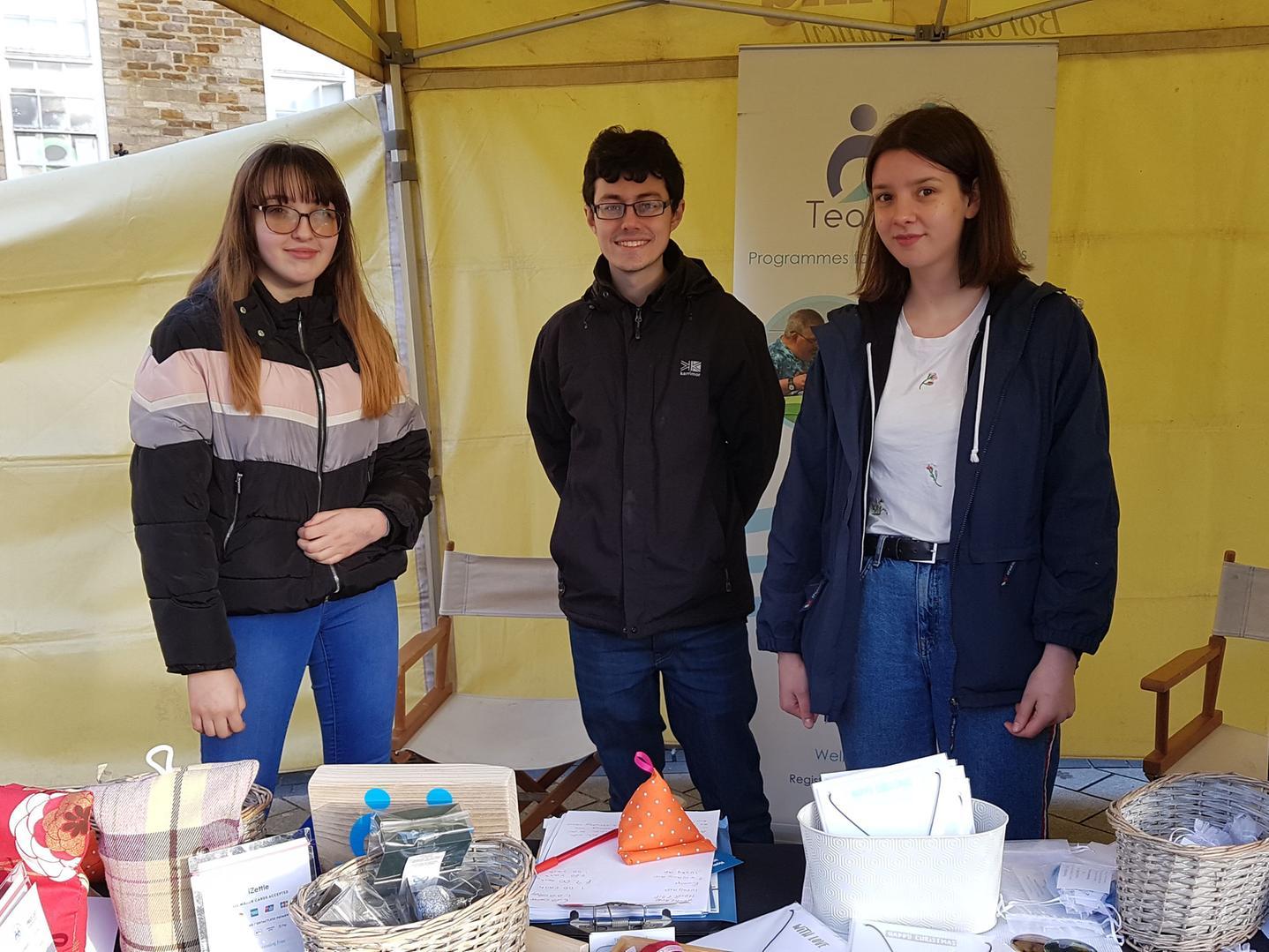 Teamwork Trust provide work-based skills, education, activities, and wellbeing services for adults with learning difficulties. All their craft items had been made by members. The stall was being run by staff member Olly (centre) and volunteers Charlotte (left), 13, and Polly (right), 17.