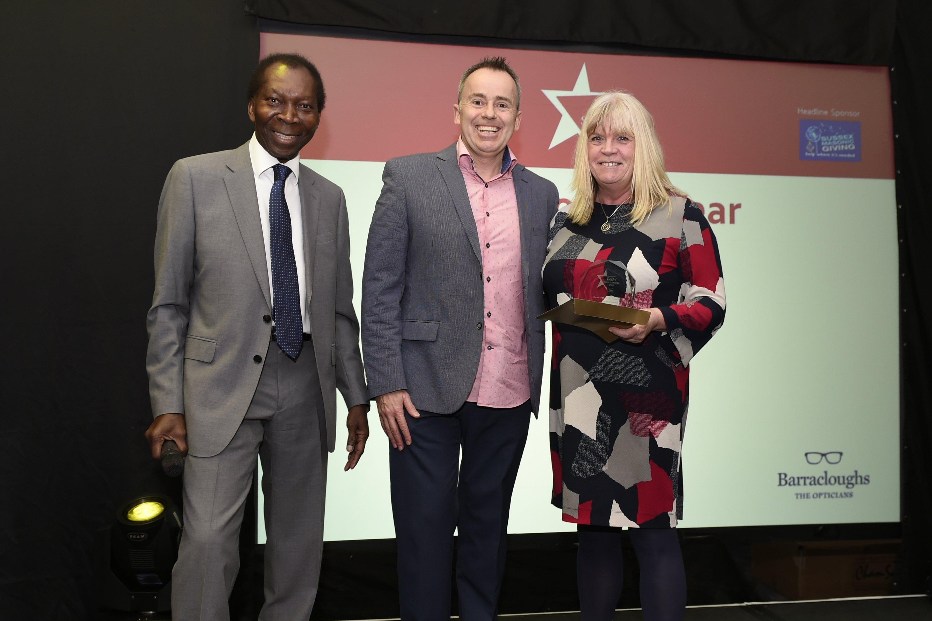 Winner of the Carer of the Year, Representative Annemarie Field with with Ambrose Hacourt (left) and Dave Cleworth of Barracloughs Opticians. Picture: Liz Pearce. 

LP192053