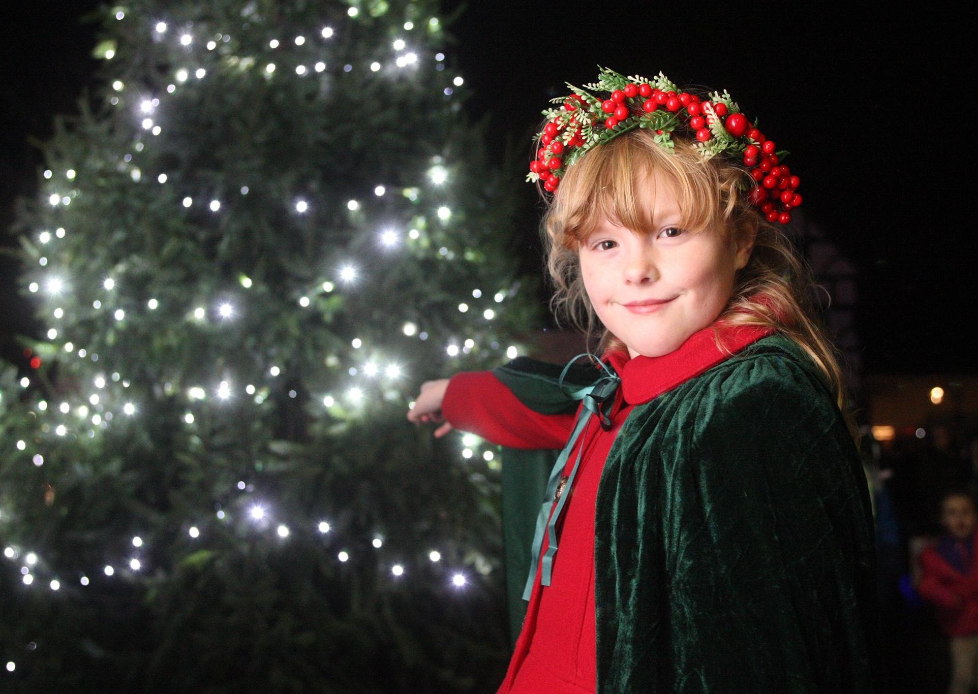 DM19121193a.jpg. Midhurst Christmas street party, 2019. Molly Shadbolt, 9, turned on the Christmas tree lights. Photo by Derek Martin Photography. SUS-190612-213943008