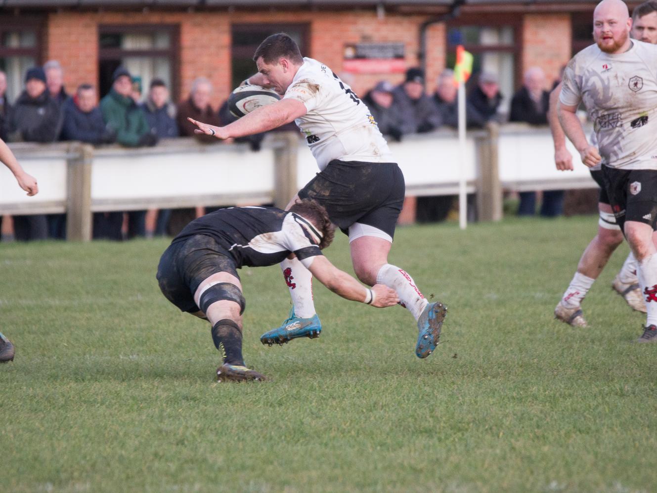 Market Harborough try to stop Andy Morrison