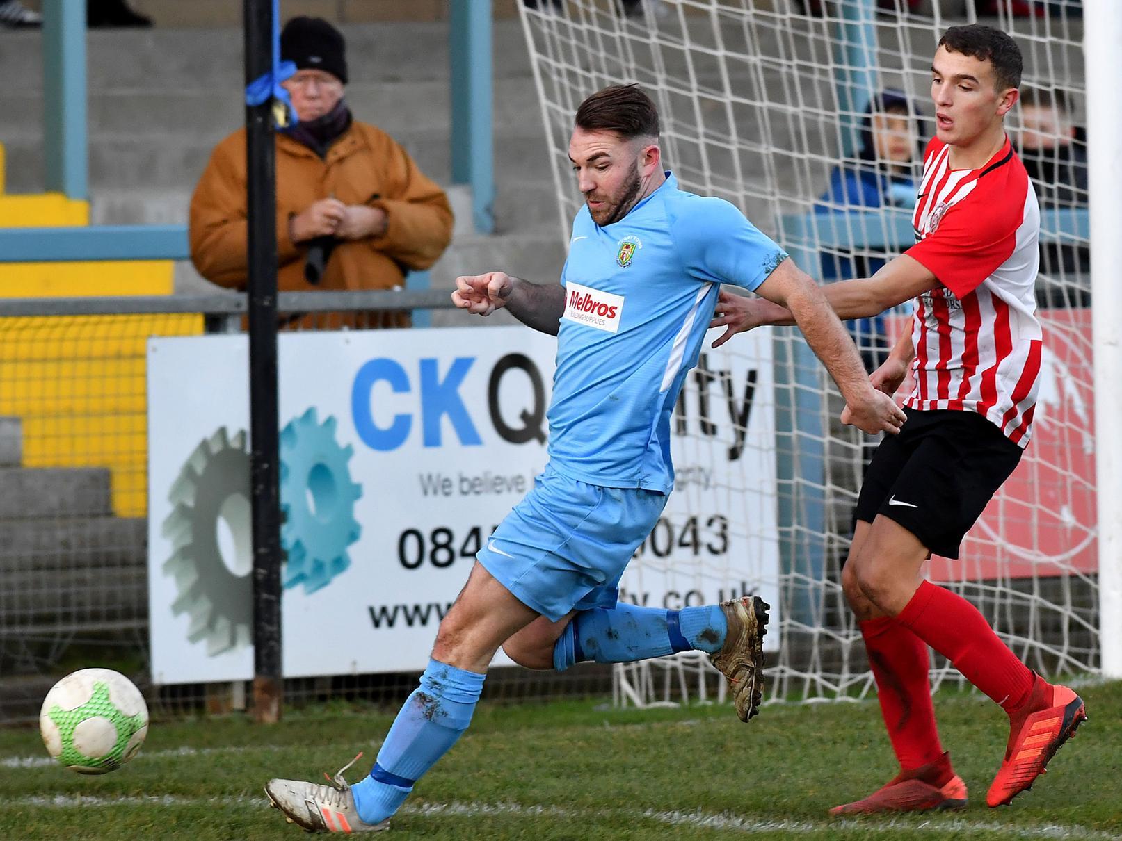 Ryan Seal collects the ball in the box against Anstey Nomads