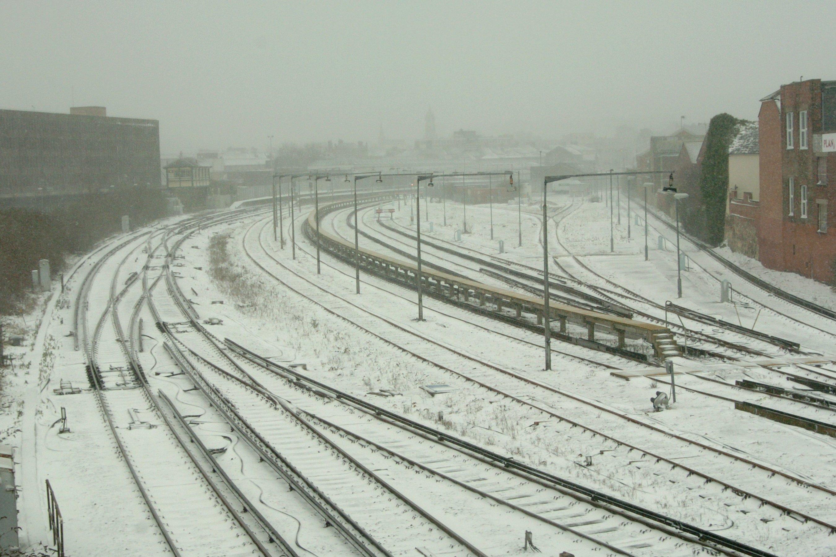 Deserted railway tracks from Eastbourne station in the snow, seen from Whitley Road bridge in March 2013