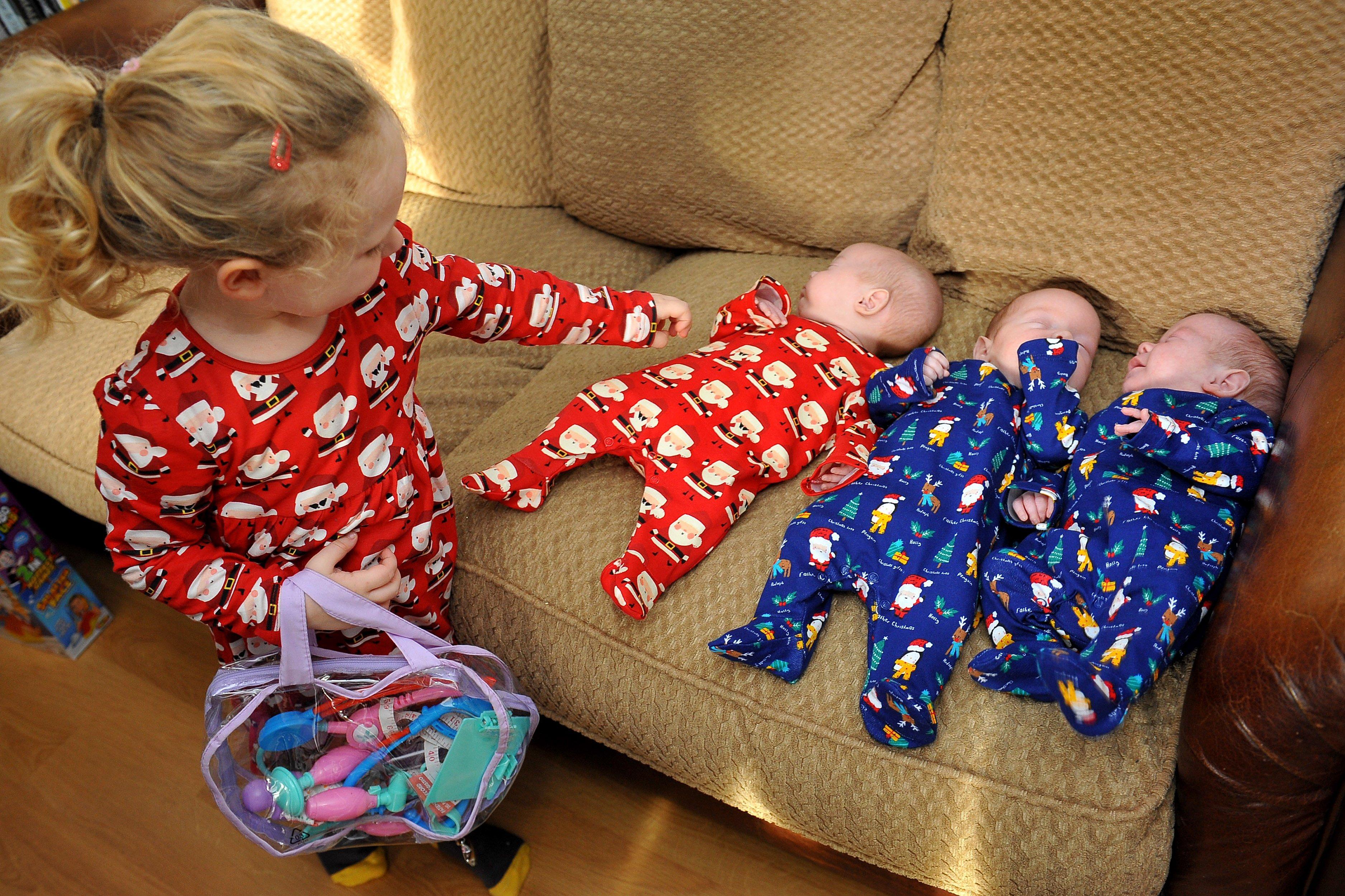 Yapton triplet's first Christmas. William, Violet, and Frank Pegrum, with big sister Betty. Pic Steve Robards