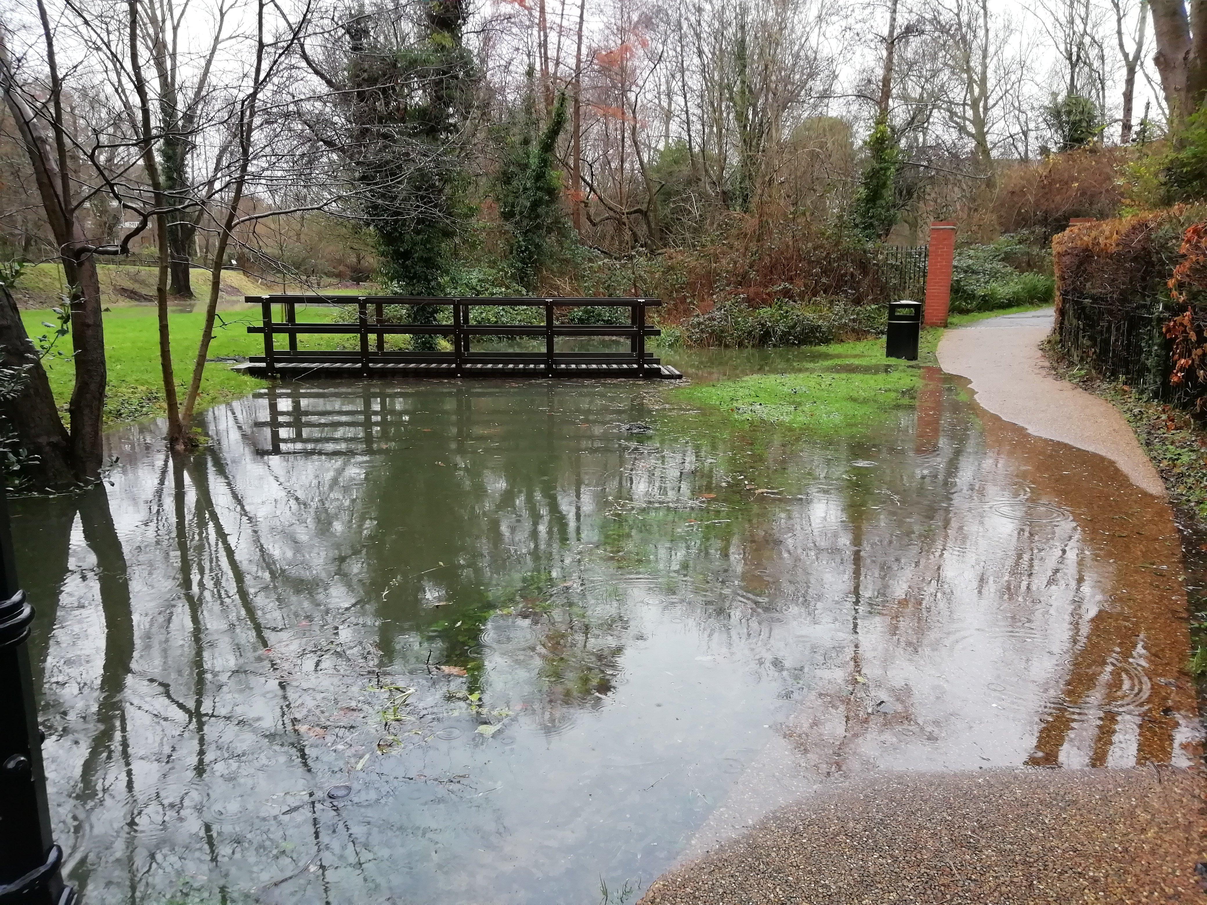 The second footbridge in the garden has been marooned in floodwater