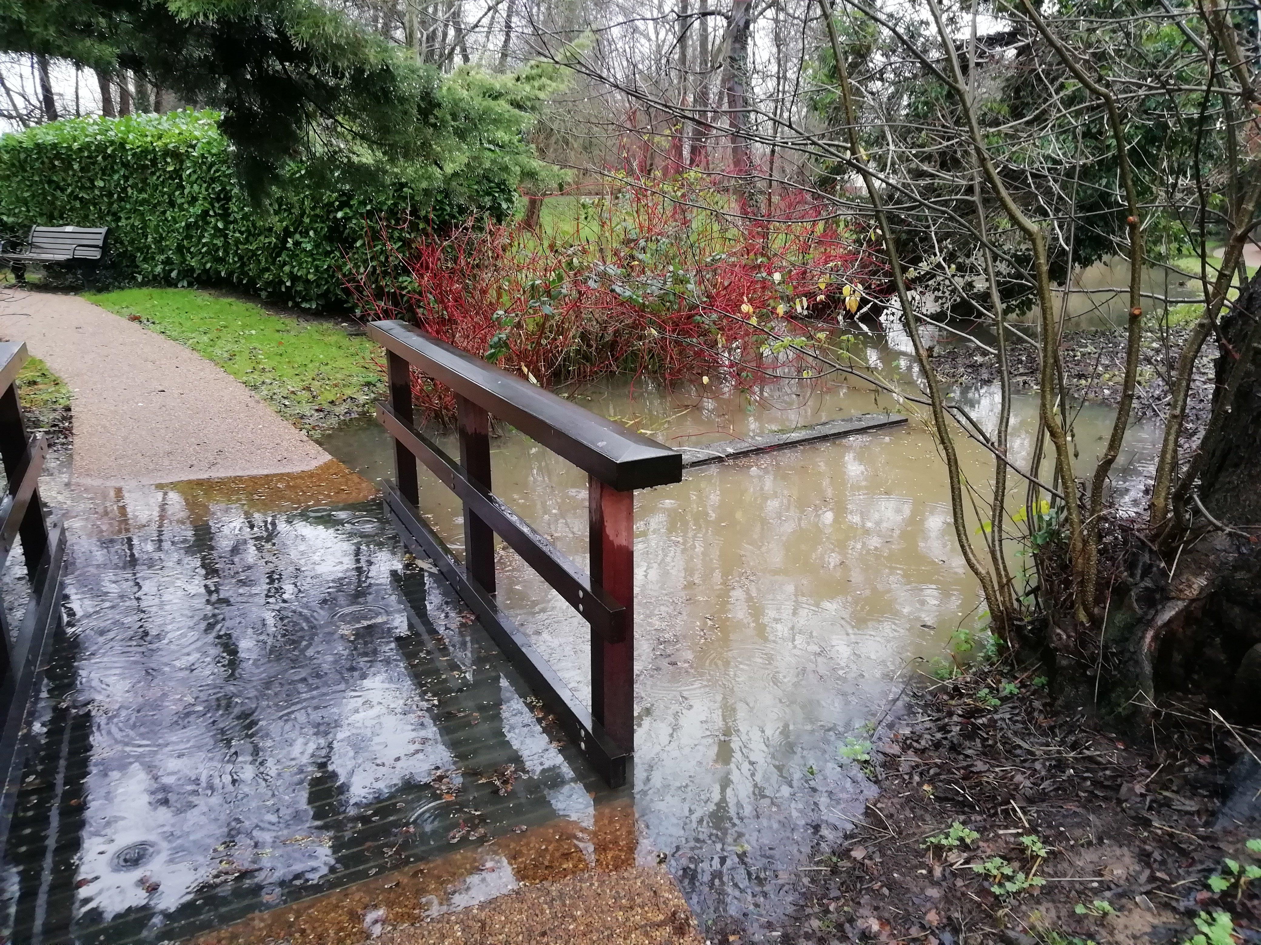 The Memorial Gardens footbridge is flooded