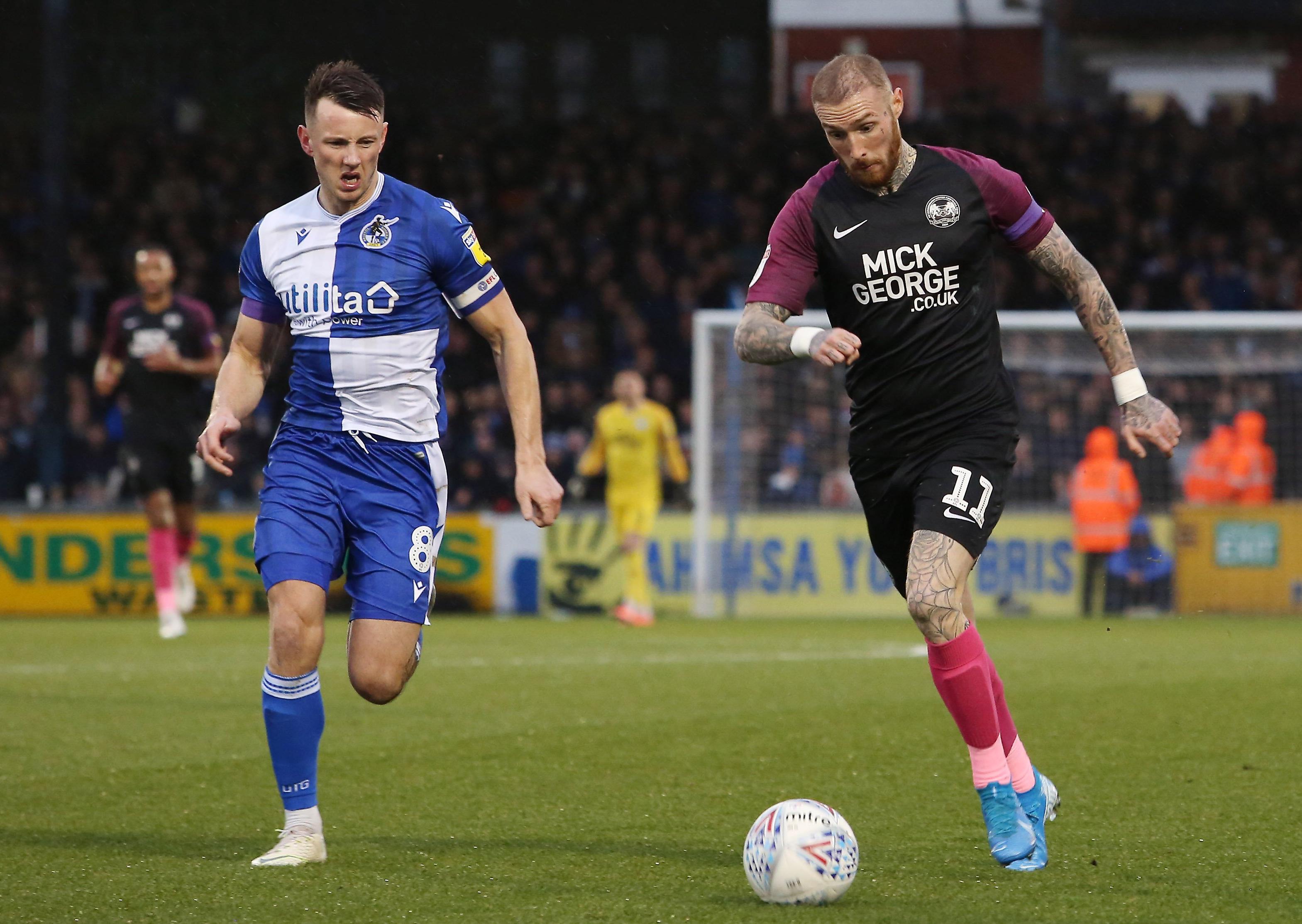 Marcus Maddison of Peterborough United in action with Ollie Clarke of Bristol Rovers . Photo: Joe Dent/theposh.com.