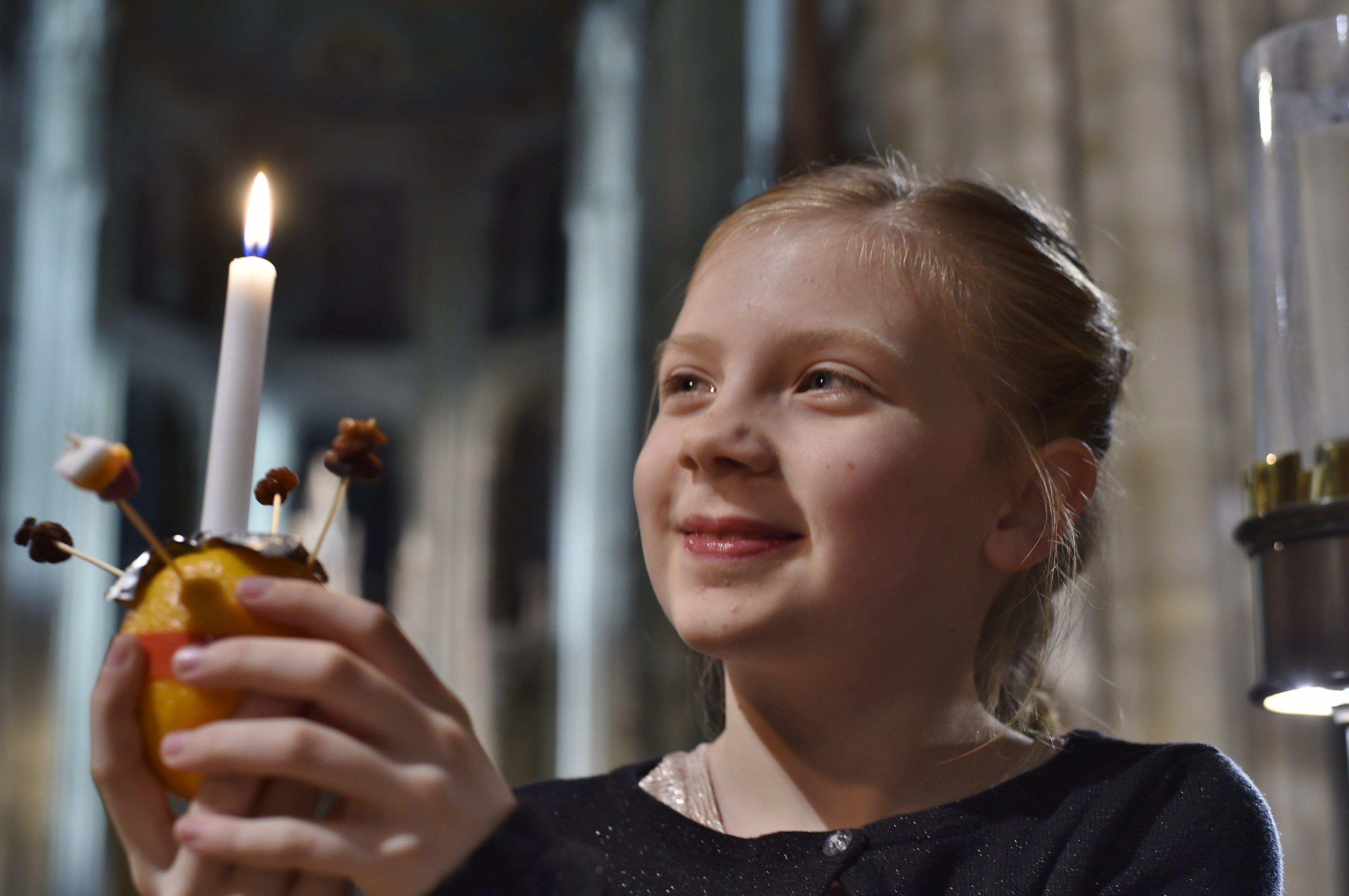 Christingle service at Peterborough Cathedral.    Bethany Jones with her Christingle 


Nat19 EMN-191220-191610009