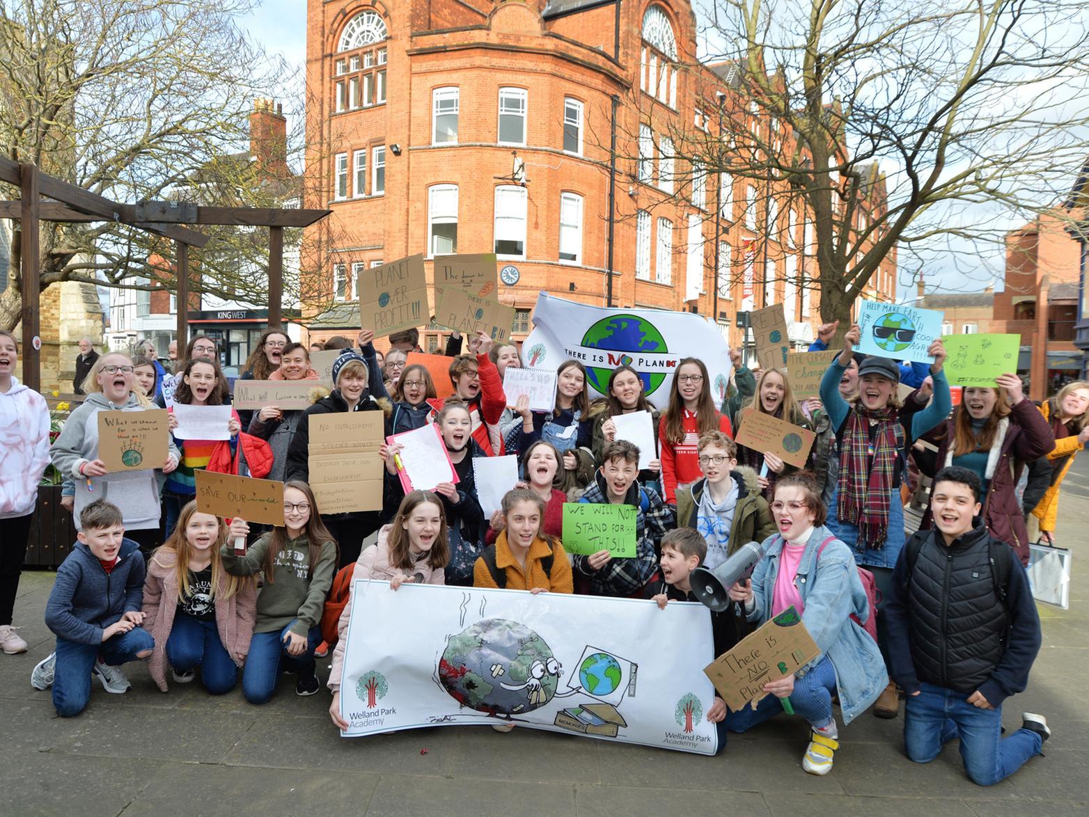 Students from two Market Harborough schools headed into the town centre after lessons to protest for more action to combat climate change.
The students from Welland Park College and Robert Smyth Academy chose not to walk out of lessons, but instead after school ended they headed into the town centre carrying banners. The protest was part of a global day of action by young people calling for more action from governments to tackle climate change. The protesters headed to Harborough District Councils offices where they met with council leader Neil Bannister, leader of the Lib Dem opposition Cllr Phil Knowles, and Neil OBrien MP.