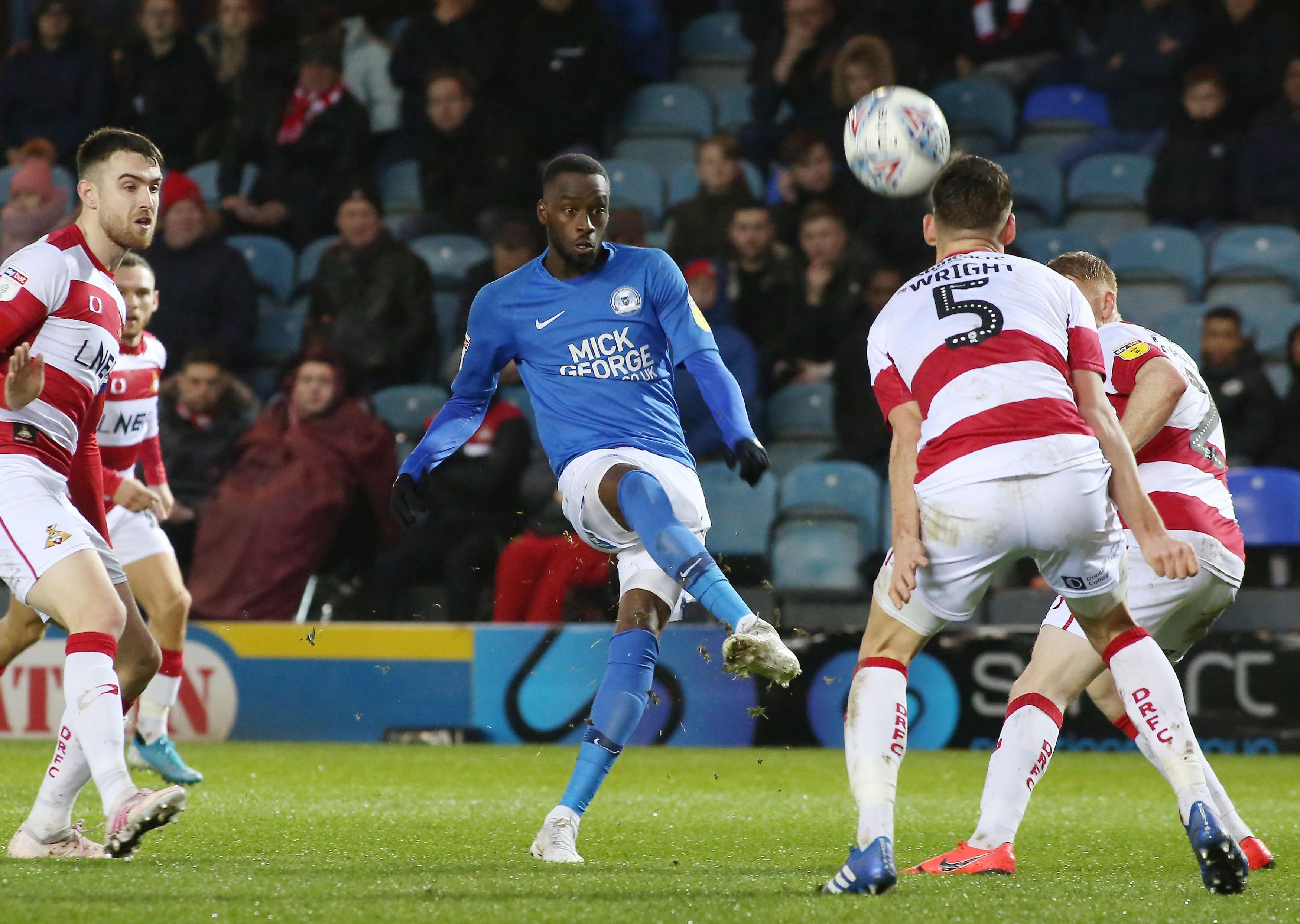 Mohamed Eisa of Peterborough United shoots at goal against Doncaster Rovers. Photo: Joe Dent/theposh.com.