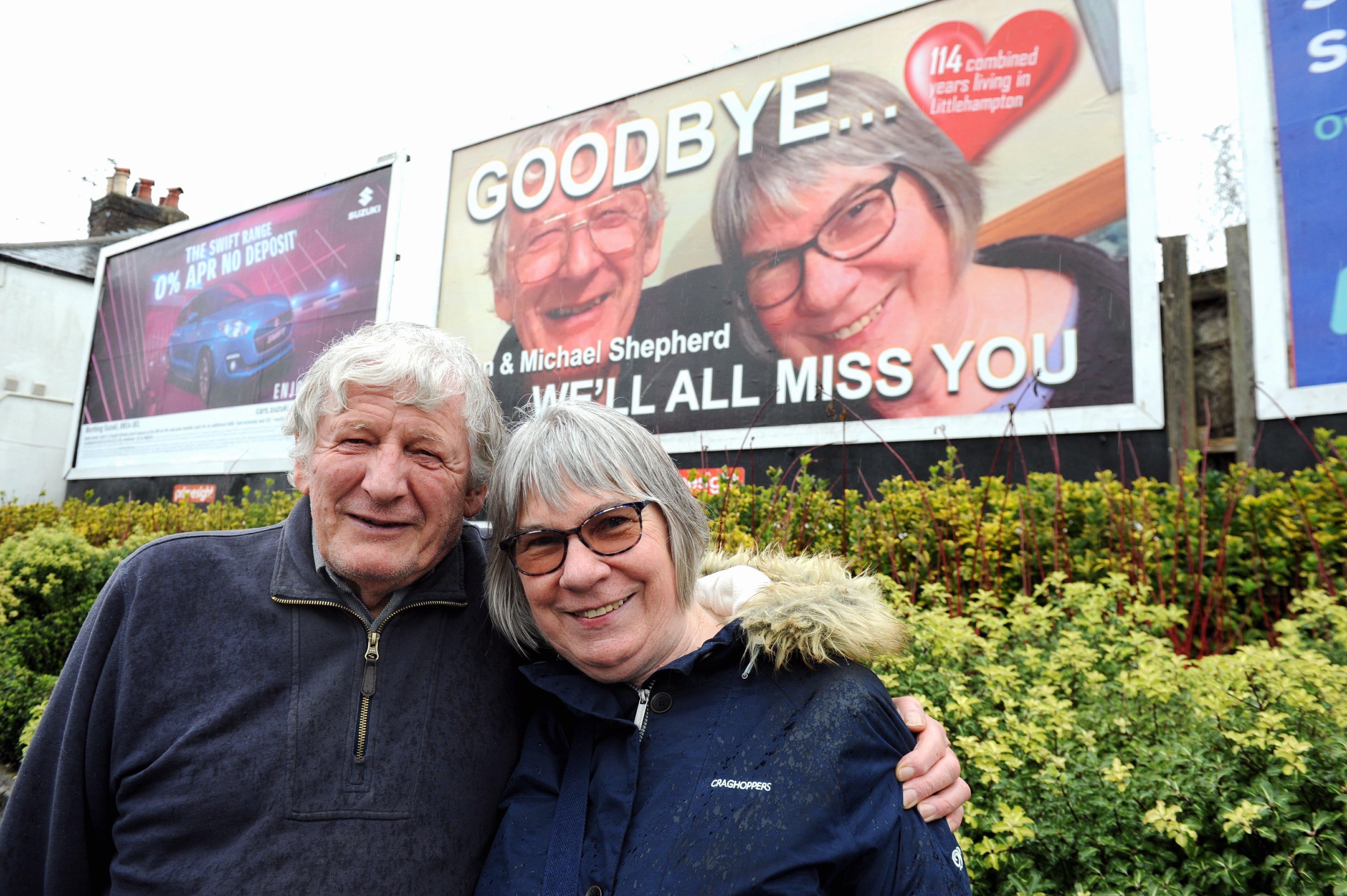 Tan and Michael Shepherd in front of the Littlehampton billboard dedicated to them. Picture: Kate Shemilt ks190080-3