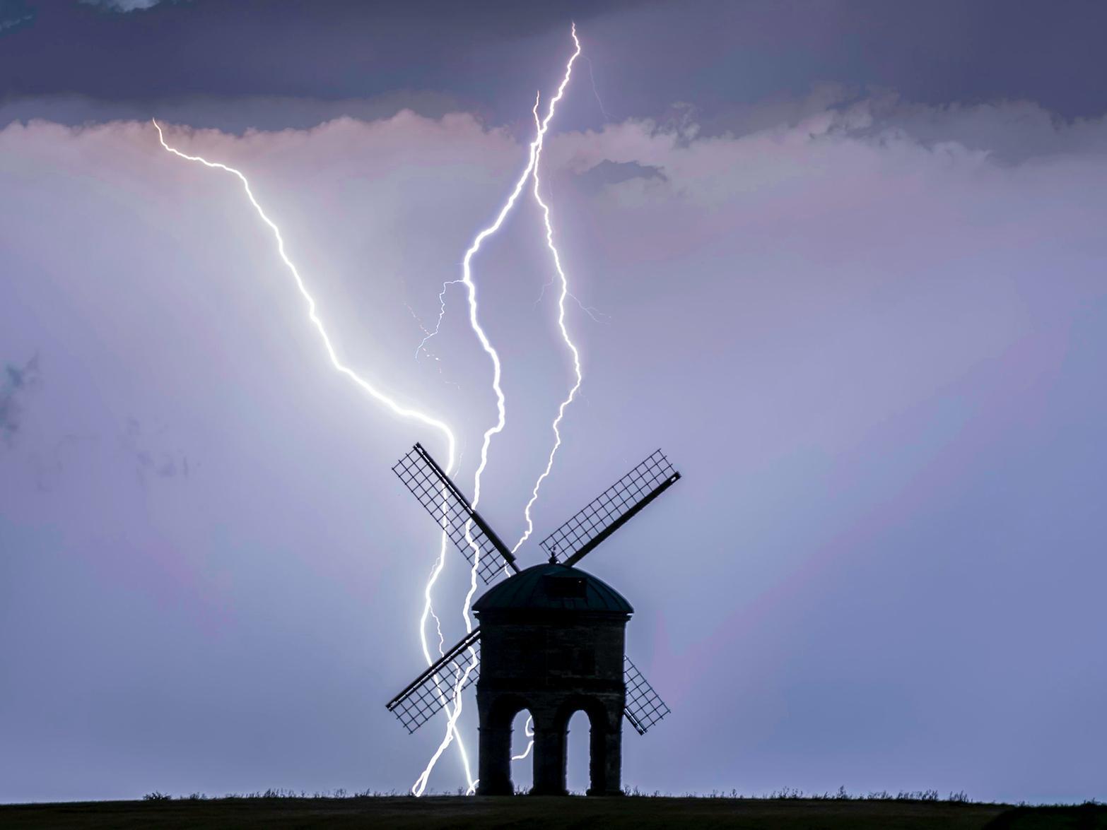 This stunning image by Chad Gordon Higgins captured the moment lightning struck at a historic windmill as heavy thunderstorms battered Britain in July.
See below for more information.