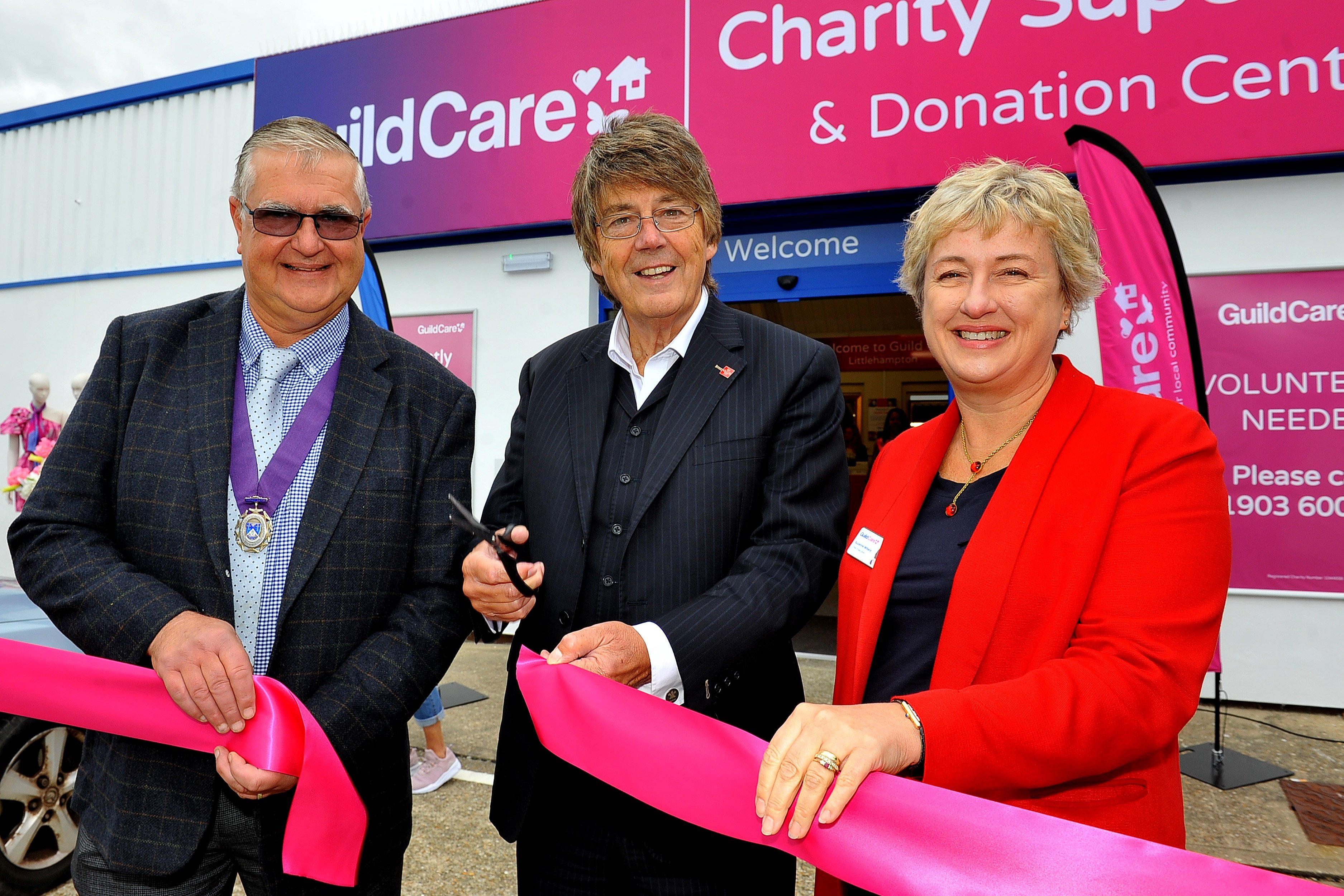 TV and radio presenter Mike Read cuts the ribbon to open the new Guild Care superstore and donation centre in Littlehampton, with chief executive Suzanne Millard and deputy mayor David Chace. Picture: Steve Robards SR03101901