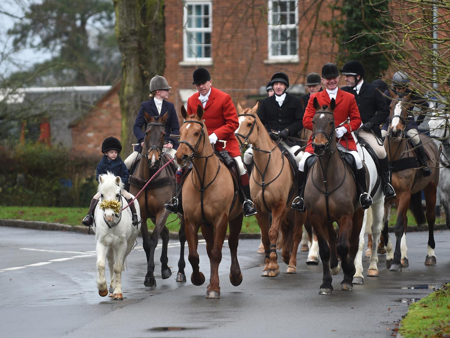 Fernie Hunt head to the Green in Great Bowden during Boxing Day.