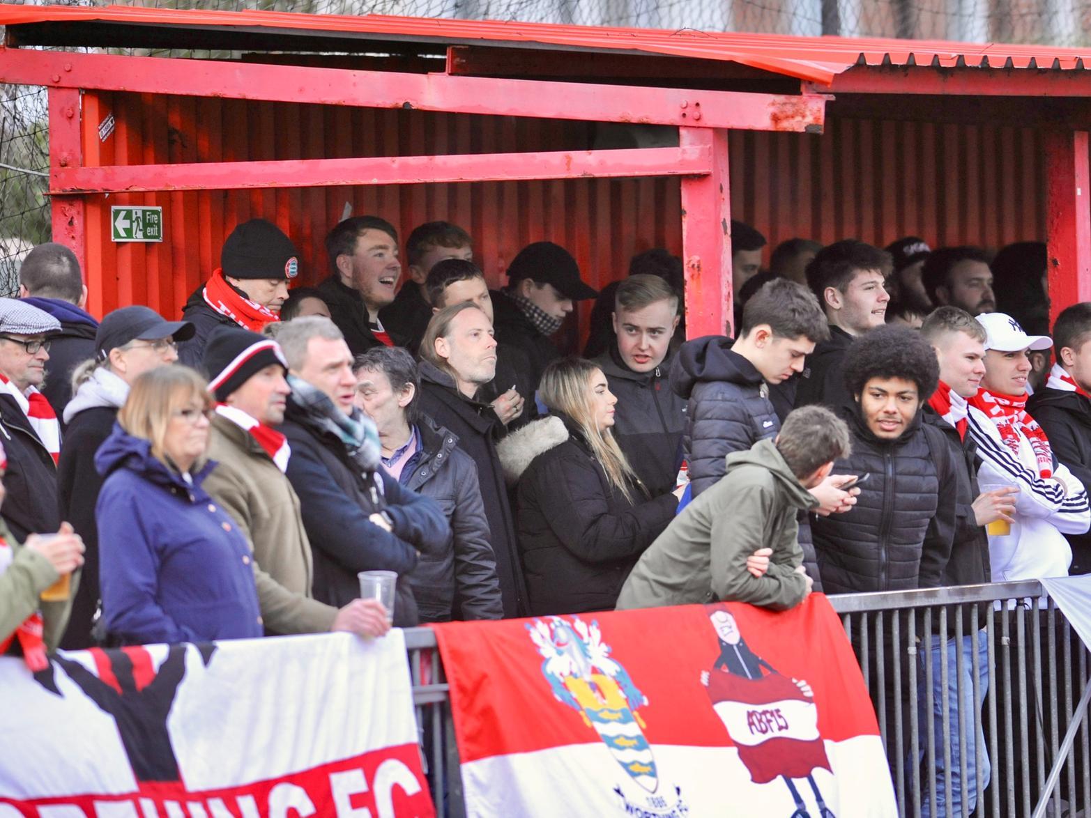 The crowd watches on at Woodside Road