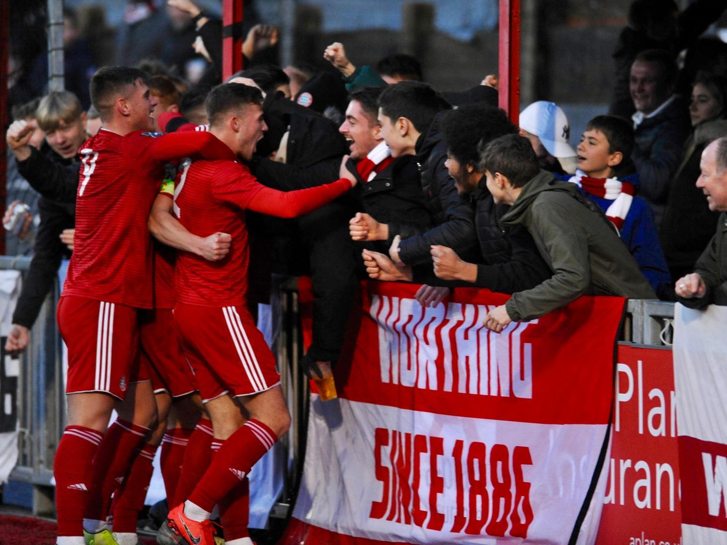 Worthing players celebrate with fans