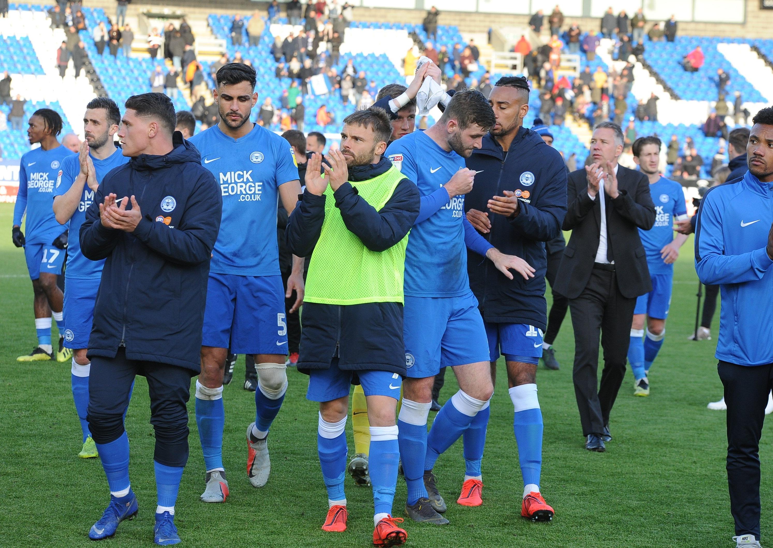 Posh players applaud the fans after the final game of the 2018-19 season.