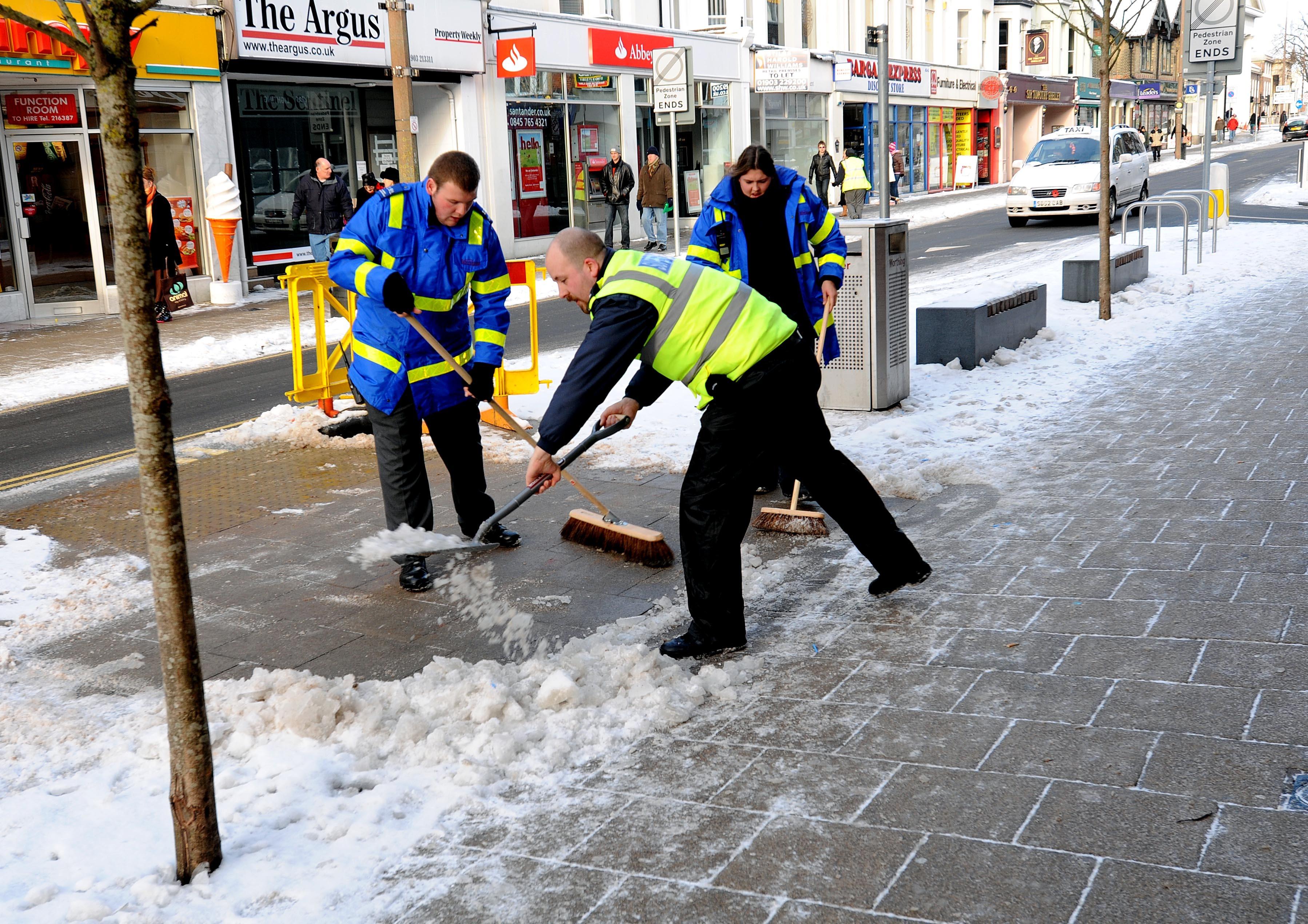 Traffic Wardens clearing snow from Worthing Town Centre. Photo: Stephen Goodger