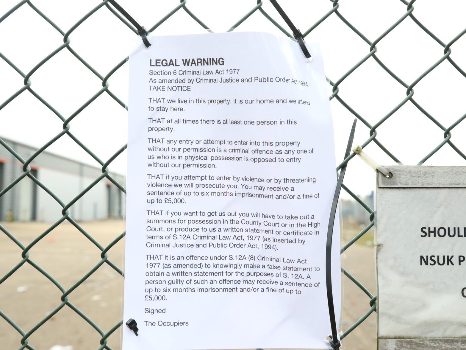 A legal notice claiming squatters' rights was tied to the fence. Pictures by Alison Bagley.