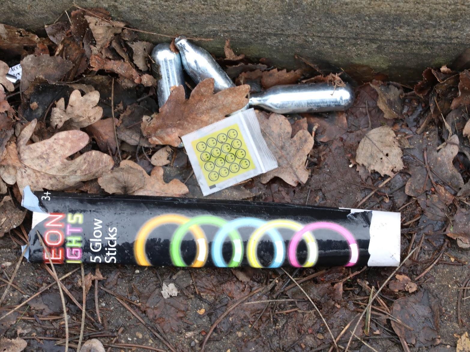 A discarded drug packet with nitrous oxide canisters and a glow stick box outside in Shelton Road. Pictures by Alison Bagley.