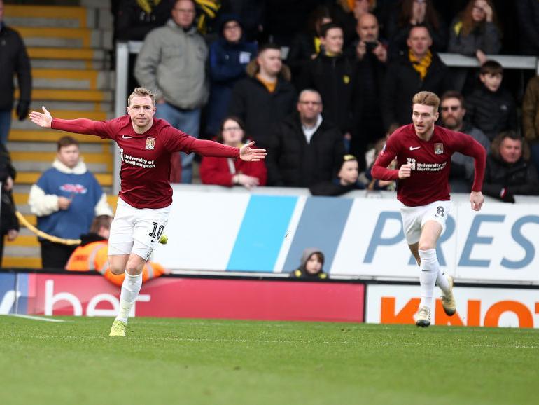 Nicky Adams celebrates after firing the Cobblers into a 1-0 lead at Burton (PIctures: Pete Norton)