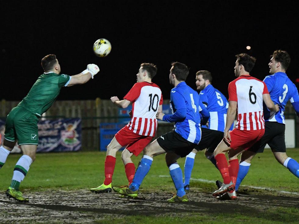 Goalmouth action as Buckingham's keeper punches clear