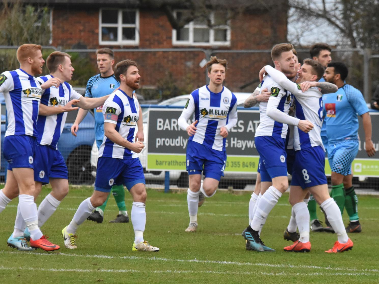 The team congratulate Josh Spinks on his goal.
