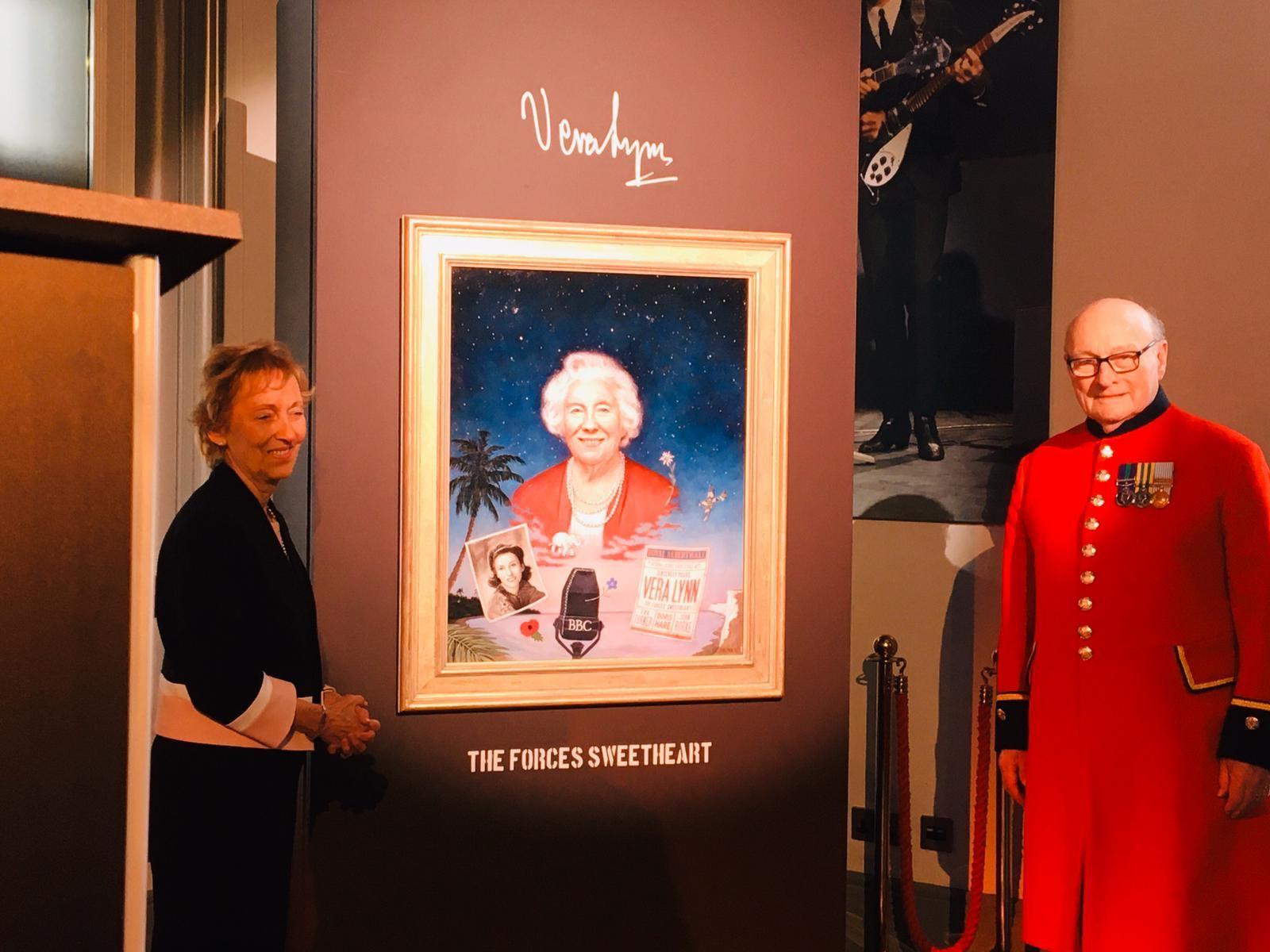 Dame Vera Lynn's daughter Virginia and Colin Thackery next to the portrait of Dame Vera Lynn