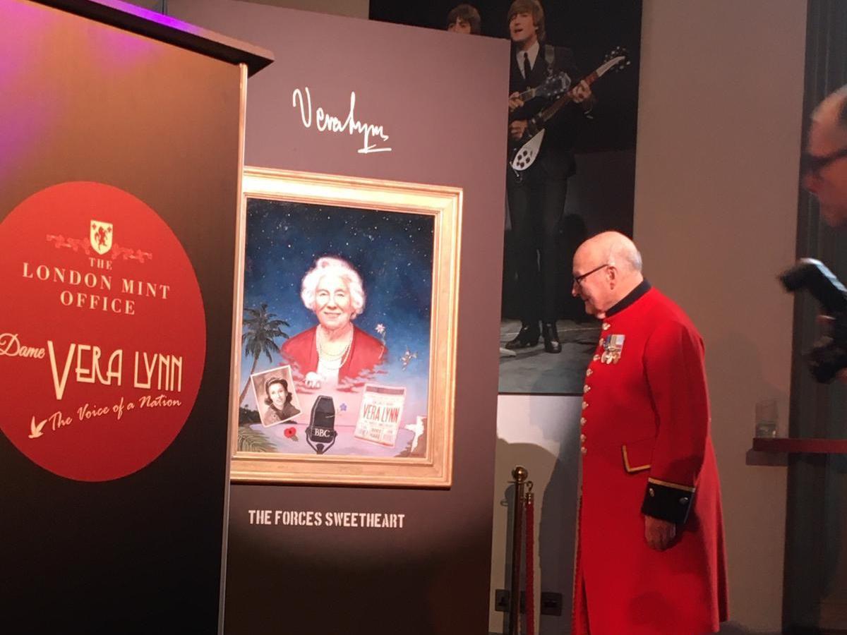 Colin Thackery next to the portrait by artist Ross Kilby