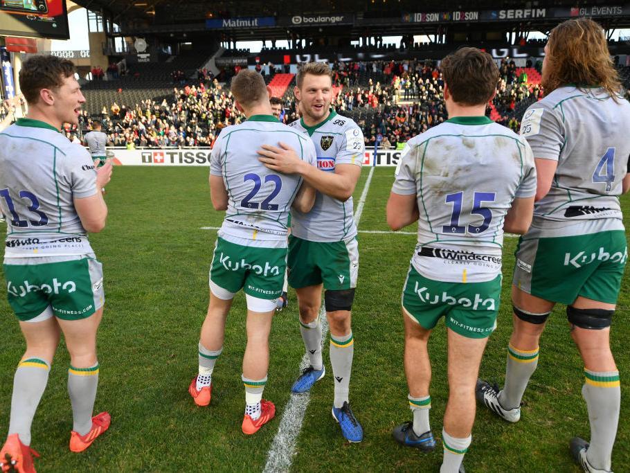 Saints players celebrate their win over Lyon