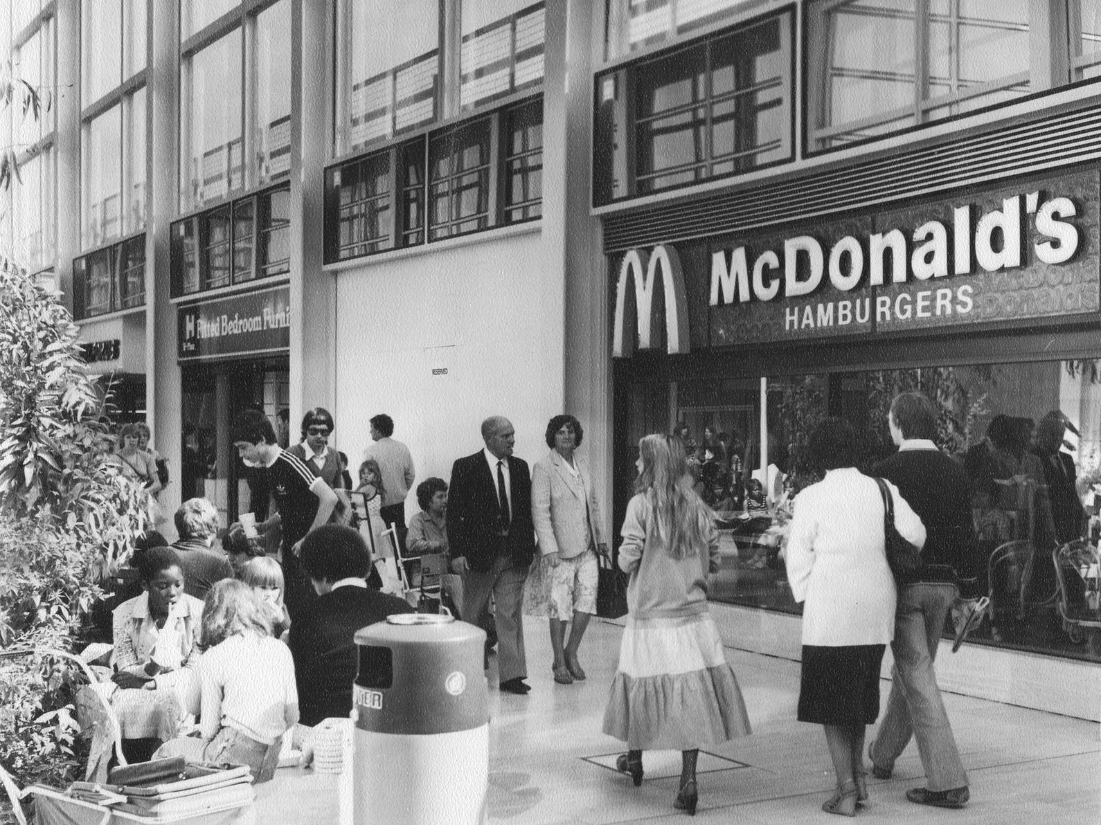 McDonald's in Central Milton Keynes Shopping Centre at Midsummer Arcade on the 16th of September 1979 by Ivor Leonard. Check out the cool clothes, what is now retro buggy and the word 'Hamburgers' in the sign