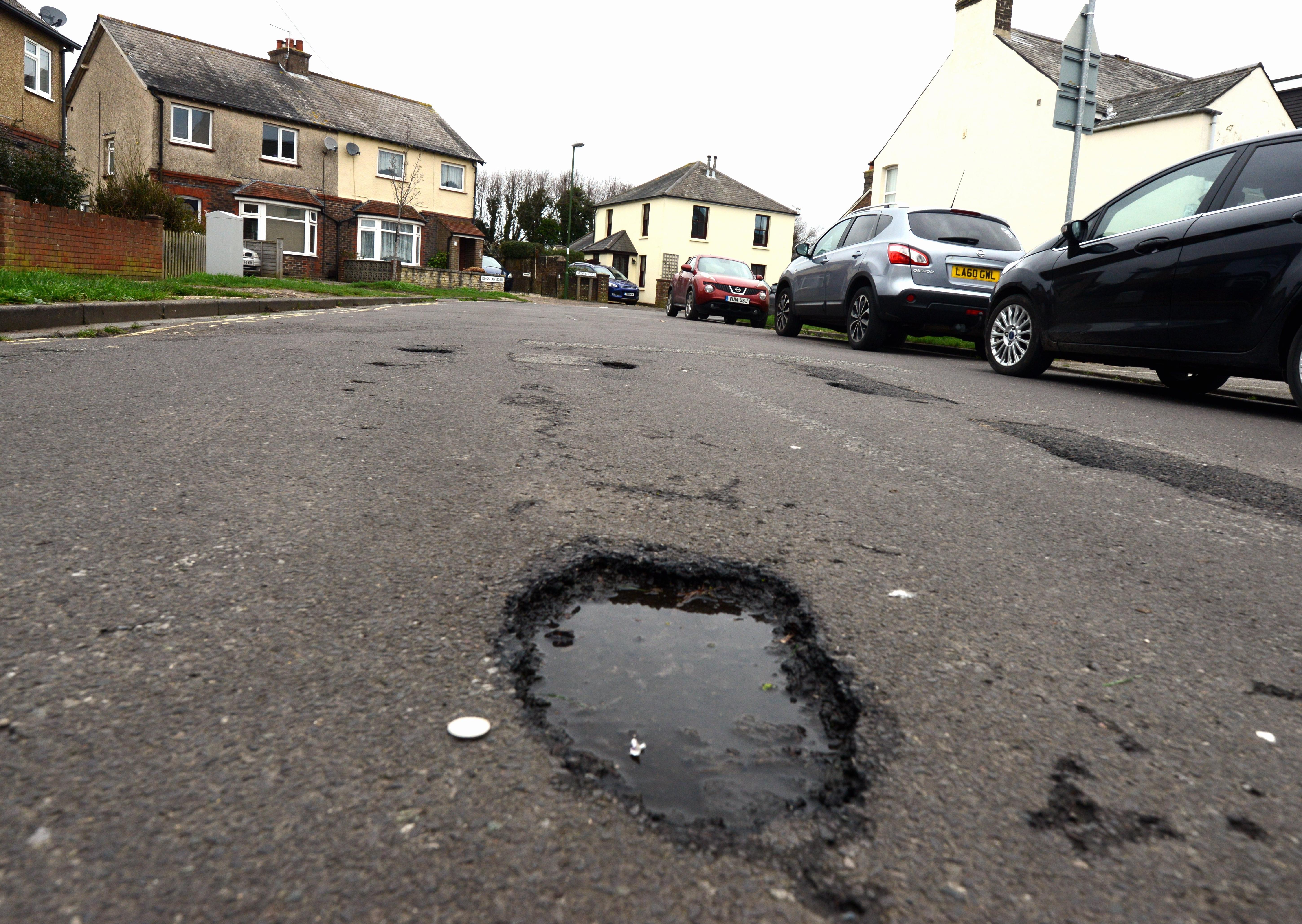 ks20009-5 Chichester Potholes  phot  kate Potholes in Kingsham Road, Chichester.ks20009-5 SUS-201201-185125008