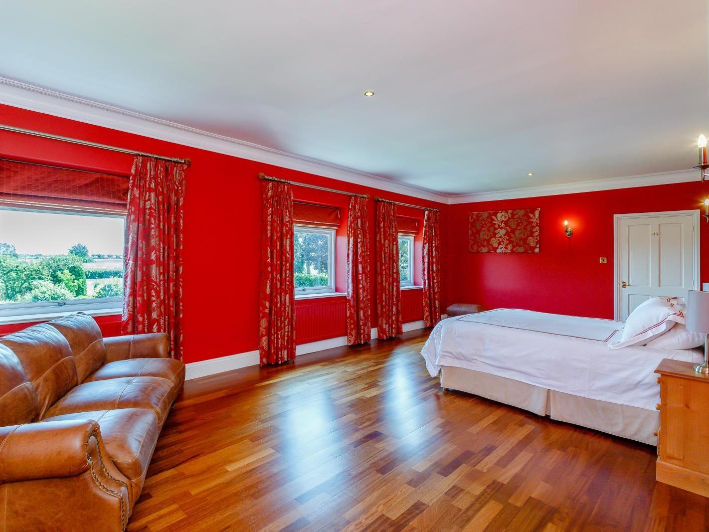 The master bedroom has an en-suite, a dressing room and a balcony. Photo: Fine and Country.